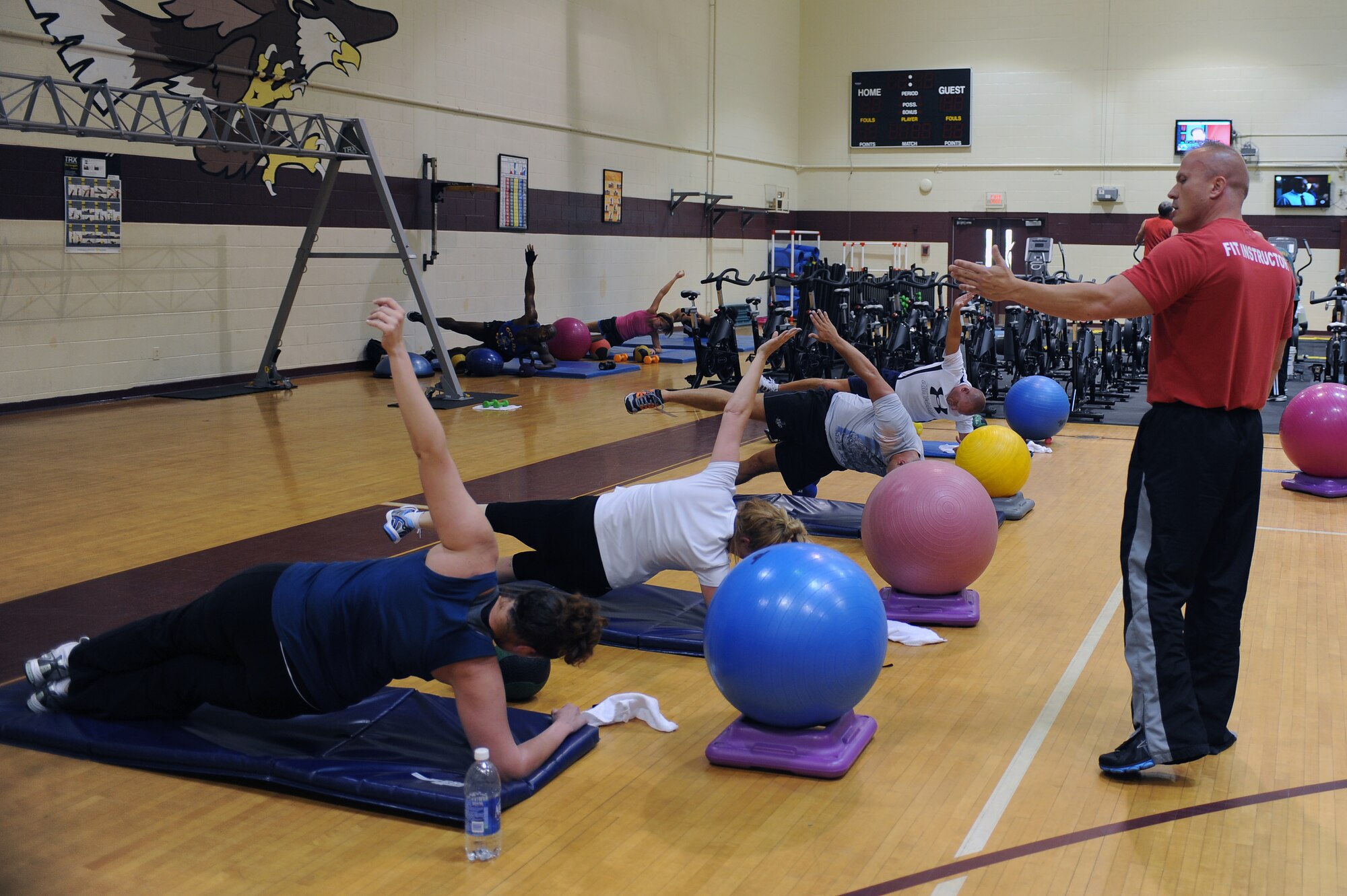 Mike Unden watches as students in the abdominal and core class perform planks in the fitness center on Seymour Johnson Air Force Base, N.C., June 6, 2012. The class is designed to strengthen core muscles in a short amount of time. Unden, 4th Force Support Squadron military fitness specialist, is from Wichita, Kan. (U.S. Air Force photo/Airman 1st Class John Nieves Camacho/Released)