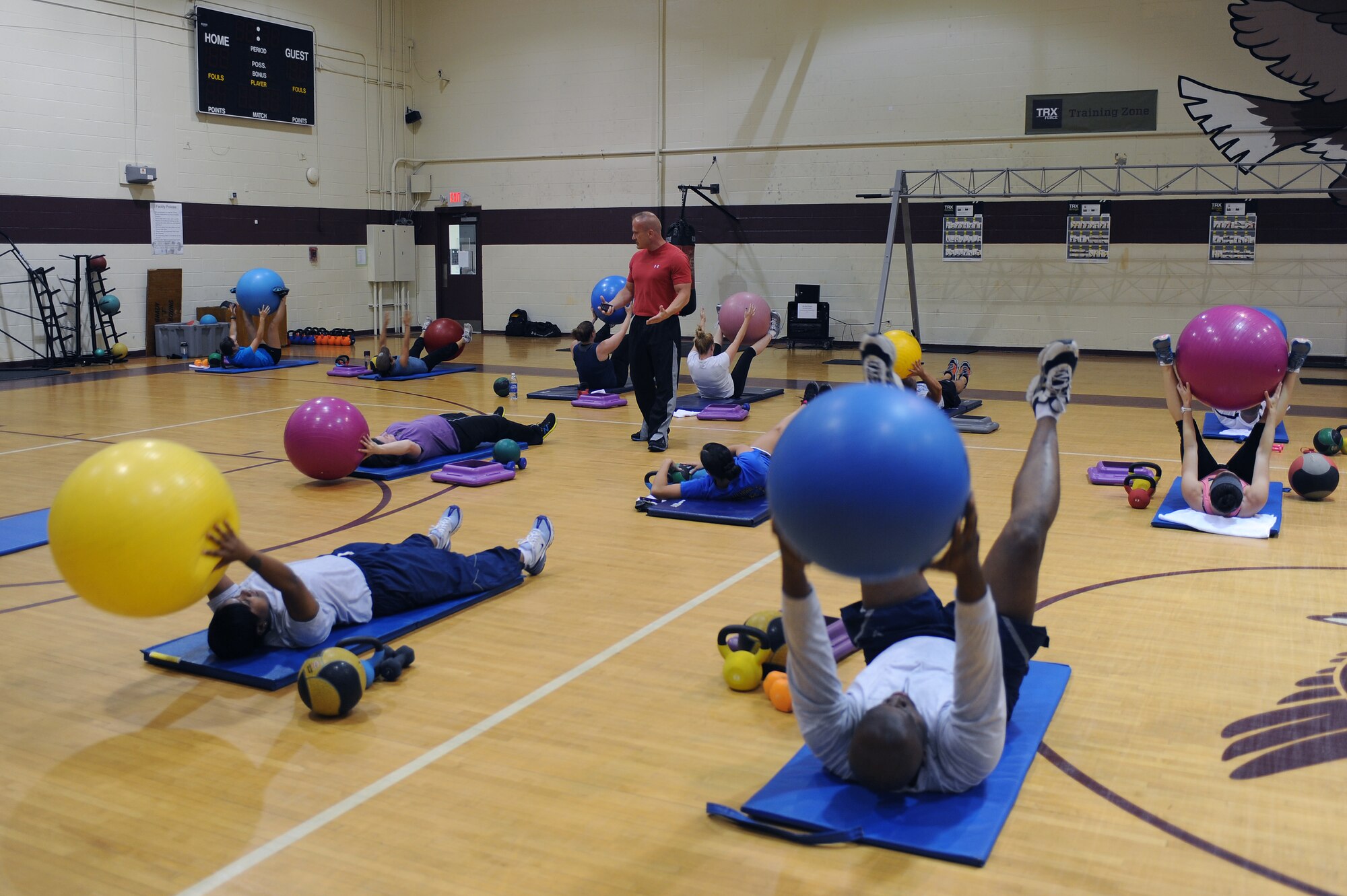 Members of Team Seymour perform exercises during the abdominal and core class on Seymour Johnson Air Force Base, N.C., June 6, 2012. The class takes place in the fitness center and is conducted Monday, Wednesday and Friday at 11:45 a.m. Anyone with access to the fitness center can come to participate in the class. (U.S. Air Force photo/Airman 1st Class John Nieves Camacho/Released)