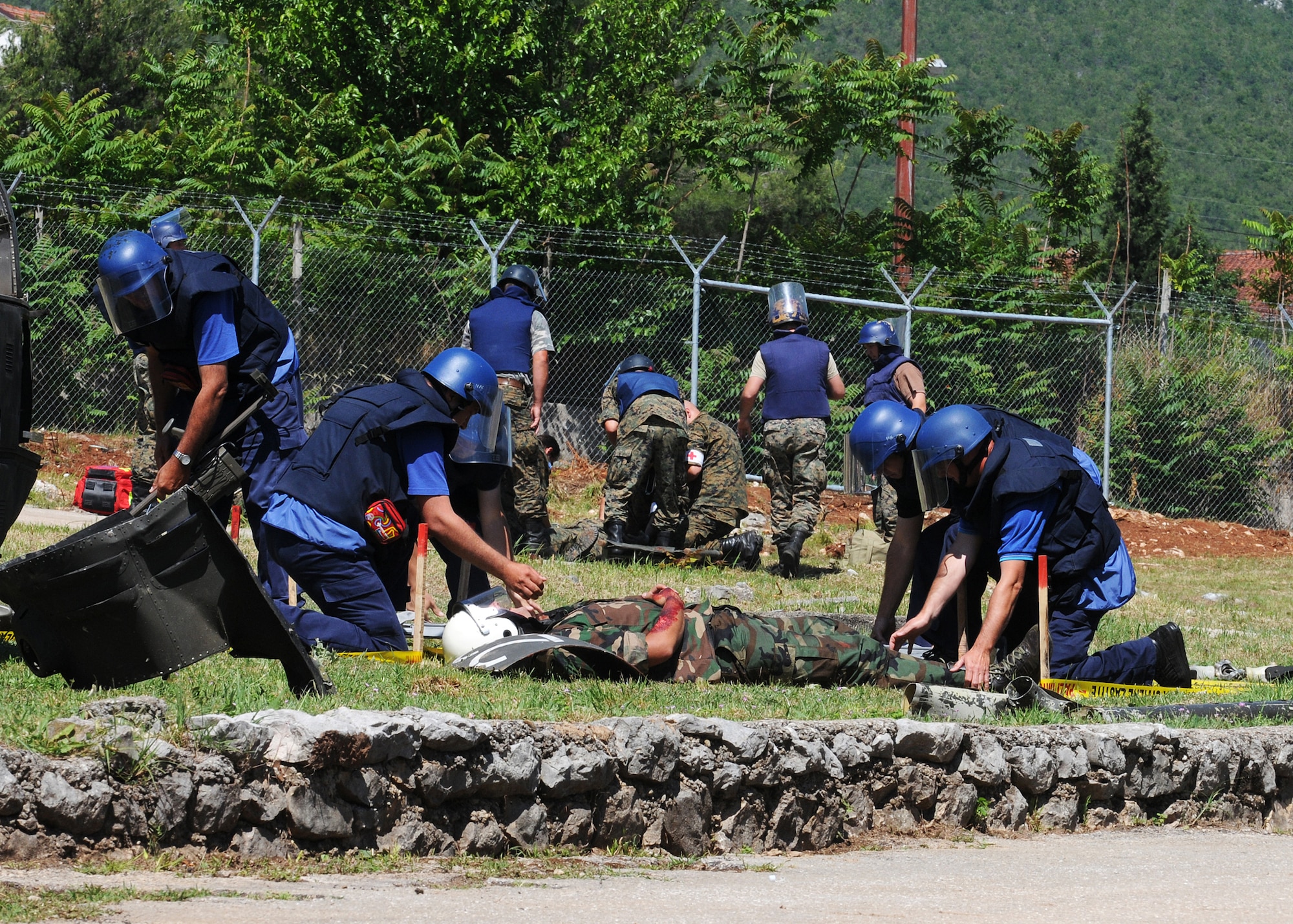 Participants of Shared Resilience 2012 remove a victim from a simulated mine field during the exercise at Capljina, Bosnia-Herzegovina, June 6, 2012. The goals of the exercise are to strengthen interoperability, facilitate training in crisis response and disaster management, and validate the readiness of deployable military medical and humanitarian assistance teams. (U.S. Air Force photo/Staff Sgt. Tabitha Lee)