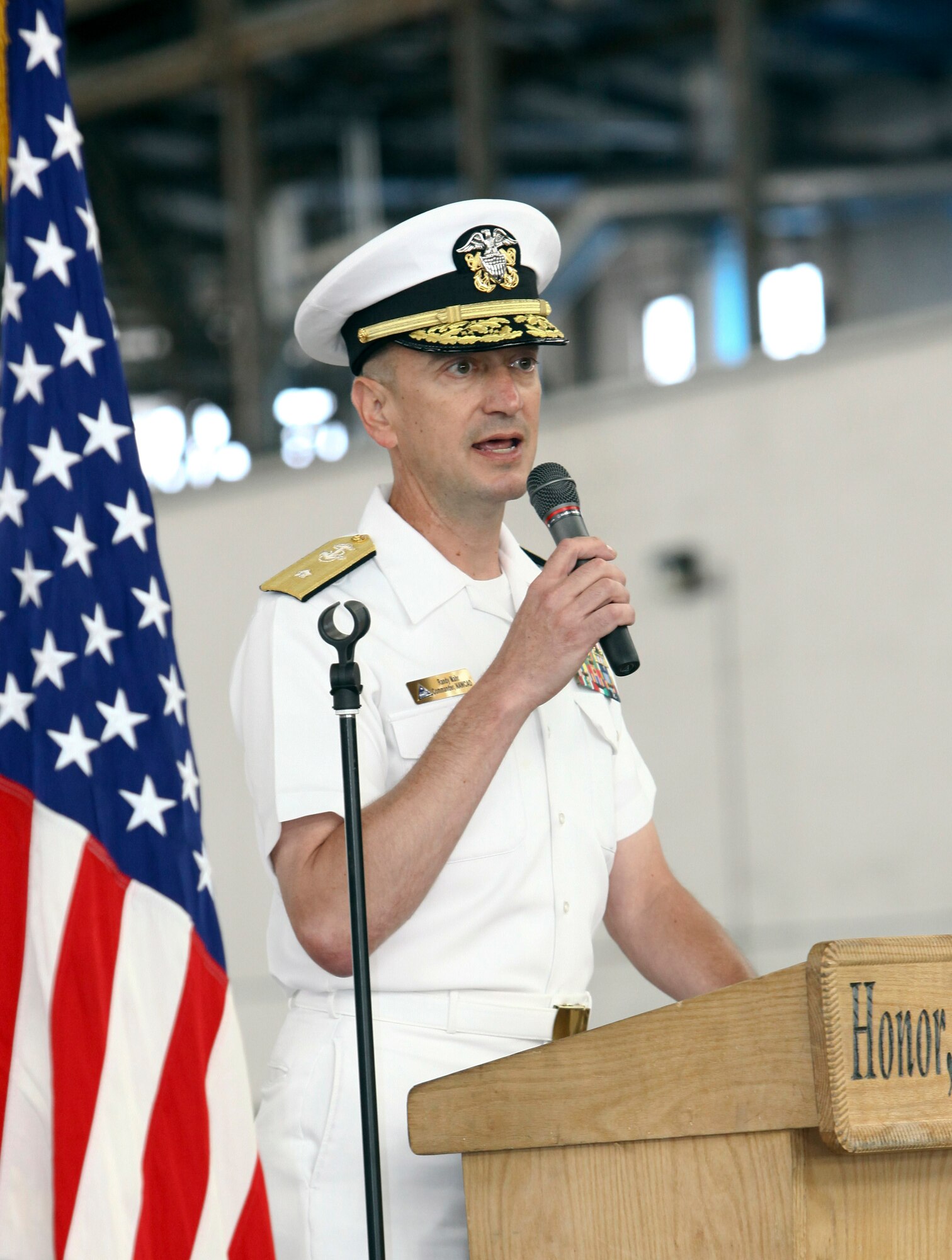 Rear Adm. Randolph L. Mahr, U.S. Navy Commander Naval Air Warfare Center Aircraft Division, addresses the Joint Base McGuire-Dix-Lakehurst community as the guest speaker for the Battle of Midway 70th Anniversary Commemoration June 4. Mahr spoke on the key role that military, contractors and civilians played in repairing the crippled USS Yorktown (CV-5) in three days of non-stop working to get her back in to the battle and the decisive role she played. (U.S. Air Force photo by Wayne Russell/Released)