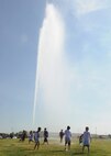 Team McConnell children get sprayed by a fire truck at the 2012 Summer Reading Program Splashdown June 4, 2012, McConnell Air Force Base, Kan. Approximately 70 Team McConnell members visited with Sparky the Fire Dog, played with a fire hose and enrolled in the McConnell Library’s reading program. This year’s program, which began June 4 and ends July 28, offers more than 45 activities to keep children’s and adult’s minds engaged during the summer months. (U.S. Air Force photo/ Airman 1st Class Katrina M. Brisbin)