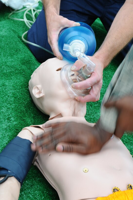 Medical technicians from the 28th Medical Group and firefighters from the 28th Civil Engineer Squadron treat a human patient simulator for injuries during first responder exercises taught by Simulation in Motion-South Dakota staff at Ellsworth Air Force Base, S.D., May 23, 2012. The use of very realistic simulated patients help Airmen apply and refine their skills, and ensure they are prepared for any accidents or incidents in the future. (U.S. Air Force photo by Airman 1st Class Zachary Hada/Released)