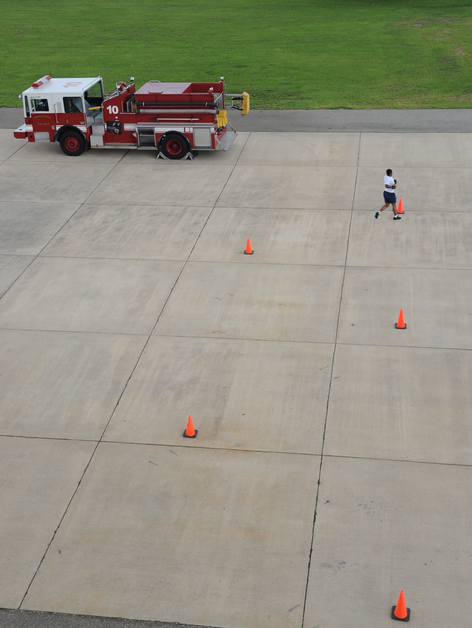 U.S. Air Force Senior Airman Denae Calmes runs around a cone as her final task during practice for a firefighter combat challenge on Seymour Johnson Air Force Base, N.C., June 5, 2012. The strategically placed cones represent fire hydrants. Calmes, 4th Civil Engineer Squadron firefighter, hails from High Point, N.C. (U.S. Air Force photo/Airman 1st Class Aubrey Robinson/Released)