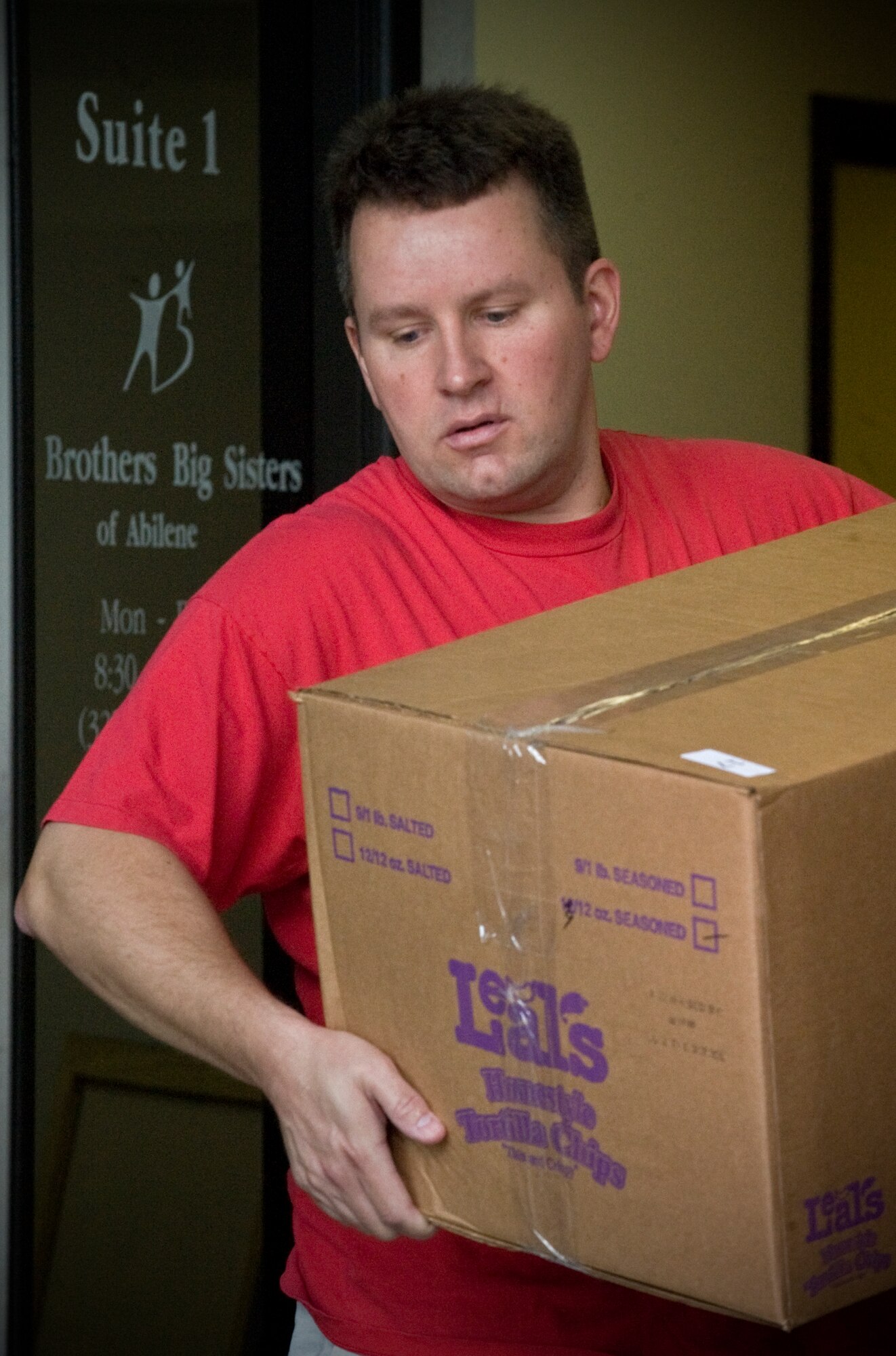 Patrick Clancy, 317th Operations Support Squadron, Dyess Air Force Base, Texas, moves Big Brothers Big Sisters’ supplies June 6, 2012, in Abilene, Texas. The BBBS program will be relocated to the old First State Bank on 547 Chestnut Street where they are expected to support more than 900 mentoring relationships. For more information, call (325) 676-2227. (U.S. Air Force photo by Airman 1st Class Jonathan Stefanko/ Released)