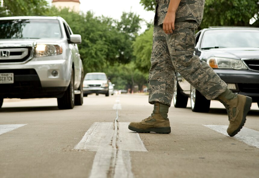 An Airman uses a cross walk to safely transit from Air Force Global Strike Command headquarters to the parking lot across Davis Avenue on Barksdale Air Force Base, La., June 7. This cross walk is one of many on base here and can be a dangerous place for pedestrians. (U.S. Air Force photo/Staff Sgt. Chad Warren)(RELEASED)