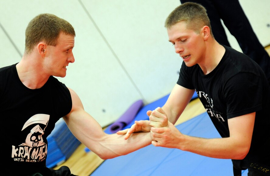 Class Instructor 2nd Lt. Benjamin Skee, 47th Flying Training Wing, demonstrates a grappling move on his partner 2nd Lt. Mike Vetri, 47th FTW, at the Krav Maga training class held at the Losano Fitness Center at Laughlin Air Force Base, Texas, June 5, 2012. Krav Maga is an Israeli developed martial art designed to defeat an opponent as quickly and aggressively as possible. (U.S. Air Force photo/Airman 1st Class Nathan Maysonet)