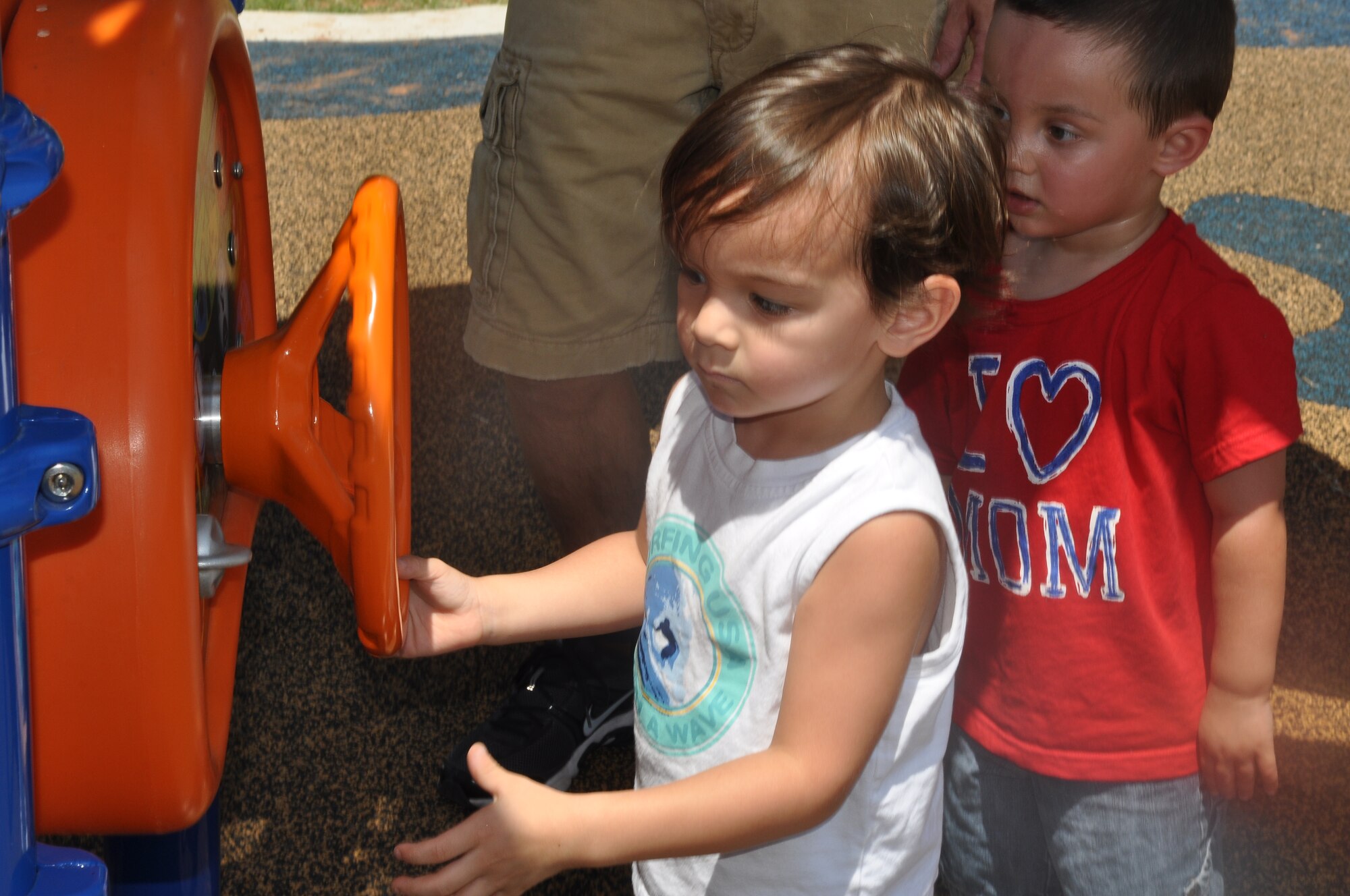 A small child gets familiar with a portion of a children’s play gym during the 307th Bomb Wing/917th Fighter Group Family Day at Cullen Park on Barksdale Air Force Base, La., June 2, 2012. The annual event is an opportunity for the Reservists and their families to get together for some fun and camaraderie. (U.S. Air Force photo/Betty Stephens)