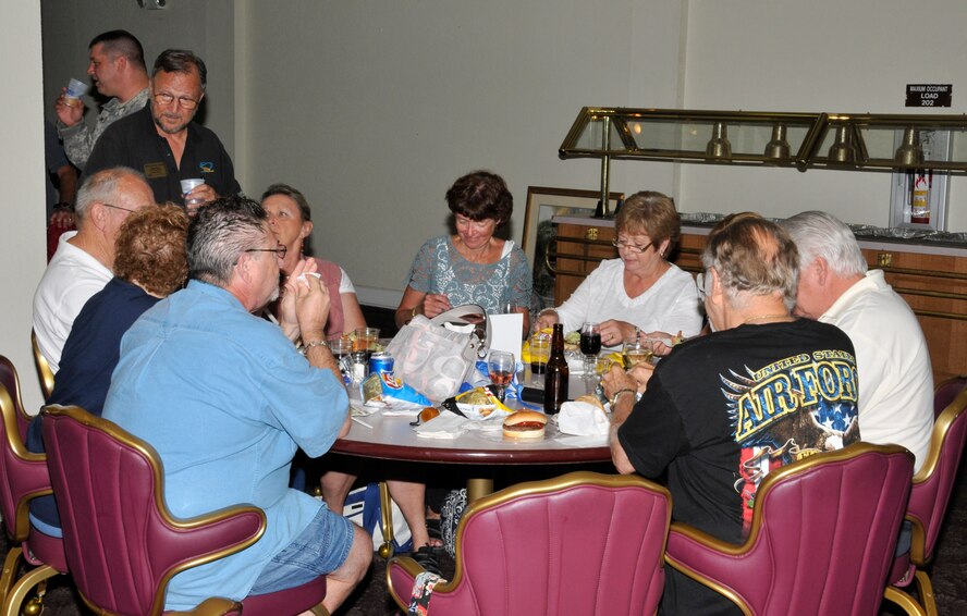 People visit at the Falcon’s Nest on Homestead Air Reserve Base during the 482nd Force Support Squadron’s Military and Family Appreciation Night, June 1. Free food and beverages were served in appreciation for the 482nd Fighter Wing Airmen and their families. (U.S. Air Force photo/Senior Airman Jacob Jimenez)