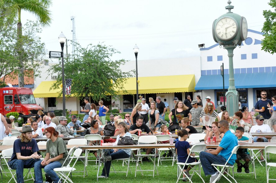 People gather at Losner Park in downtown Homestead during the city’s first annual Military Appreciation Day, June 2. The day featured an F-16 flyover from pilots of Homestead Air Reserve Base’s 93rd Fighter Squadron, live-music performances from bands Main Highway and No Restrictions, a variety of food trucks, children’s activities, and a proclamation from Homestead Mayor Steven Bateman and city council was presented to Col. Donald Lindberg, 482nd Fighter Wing commander, in honor of Homestead’s local servicemembers and their families for their dedication and sacrifice. (U.S. Air Force photo/Ross Tweten)