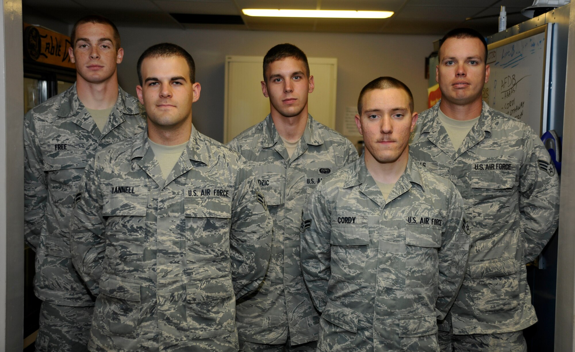 From left to right: Senior Airman Carl Free, Airman 1st Class Travis Yannell, Airman 1st Class Norbert Dudzic, Airman 1st Class Eli Cordy and Senior Airman Michael Wells, members of the 744th Communications Squadron's Airman Motivation Program (AMP), pose for a photo May 9 inside Building 1539. AMP encourages Andrews' base populous to seek self improvement through activities that foster teamwork, physical fitness and unit camaraderie. (U.S. Air Force photo/Senior Airman Lindsey A. Porter)
