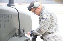 Senior Airman Angel Rivera ensures all the necessary paperwork is done in order to launch a KC-135R Stratotanker. Rivera is a crew chief with the 916th Air Refueling Wing. (USAF photo by Staff Sgt. Mark Thompson, 916ARW/PA, released)