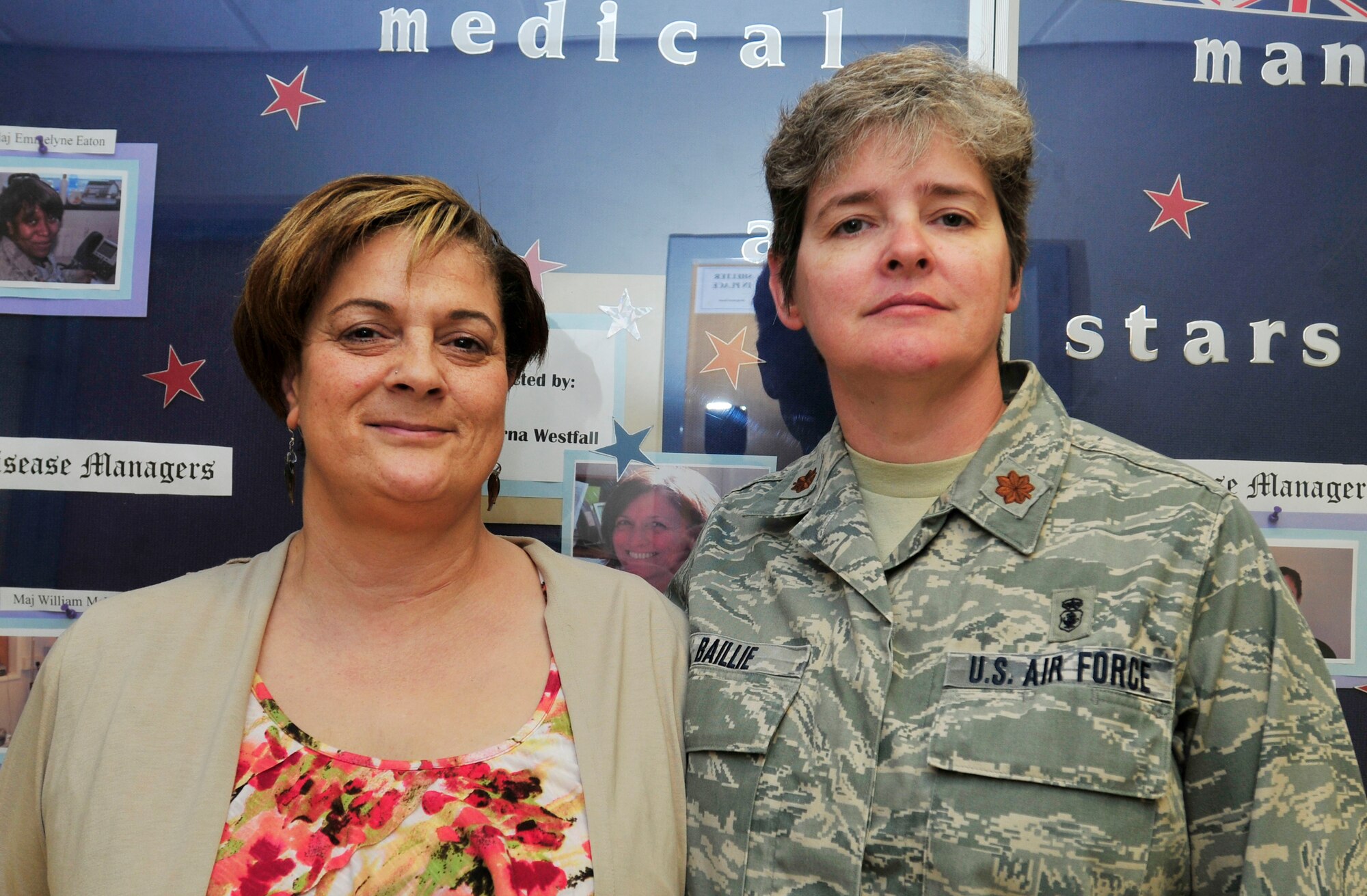 ROYAL AIR FORCE LAKENHEATH, England - Sharon O’Garro, 48th Medical Group nurse case manager, stands with her boss Maj. Judith Baillie, 48th MDG healthcare integrator and director of medical management, at the hospital June 5, 2012. After being submitted by Baillie, O’Garro was awarded the Case In Point Platinum Award for the 48th MDG New Horizons Wounded Warriors support group program she developed. The program offers improved counseling for the personal well-being and long-term healing of wounded Airmen. (U.S. Air Force photo by Senior Airman Tiffany M. Deuel)
