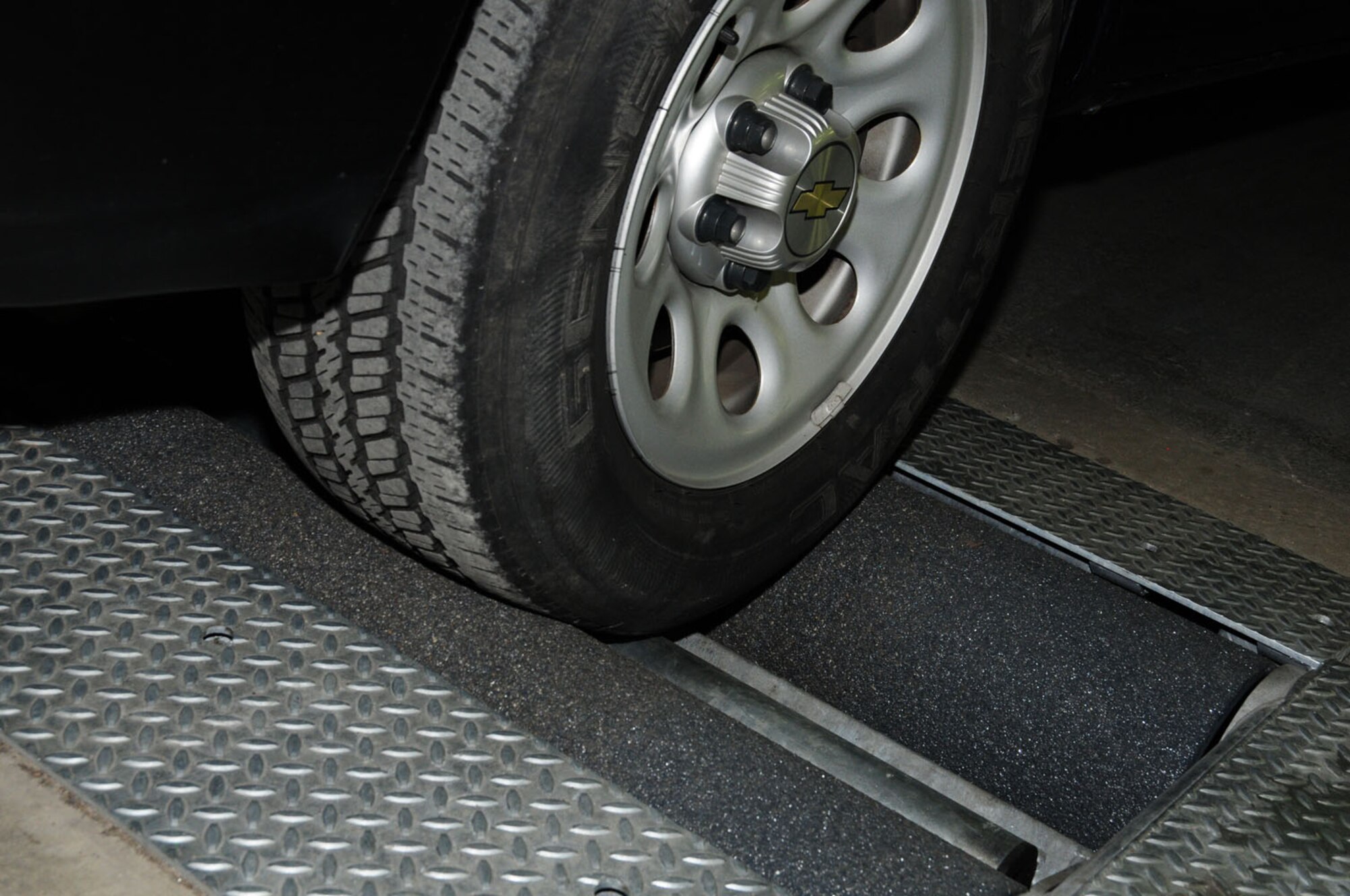 RAF MILDENHALL, England – A government vehicle runs on the newly-installed rolling-road brake-testing machine in the 100th Logistics Readiness Squadron Vehicle Maintenance facility May 30, 2012. The equipment is unique to the United Kingdom and meets British Ministry of Transport standards. Vehicle maintenance will also be getting a shaker lift to ensure they are fully compliant with MOT testing. Eventually, all government vehicles that are required to be driven off-base will be given an MOT-style test to ensure they comply with U.K. laws. (U.S. Air Force photo/Karen Abeyasekere) 