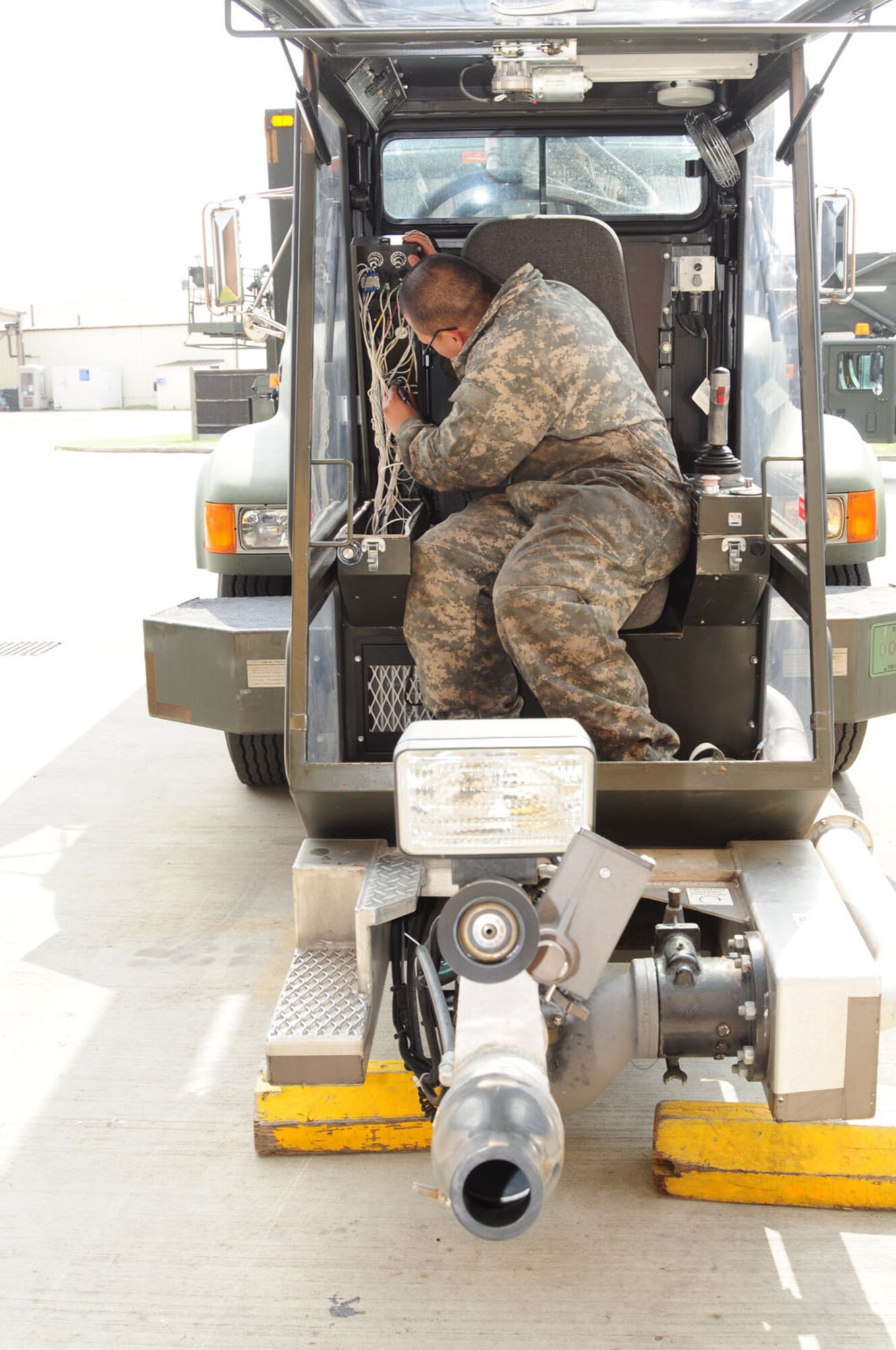 RAF MILDENHALL, England -- Staff Sgt. Dan Coching, 100th Logistics Readiness Squadron Special Purpose Vehicle Maintenance, inspects the wiring on a deicer vehicle May 30, 2012. The vehicle management flight is divided into sections – general purpose, special purpose and fire truck vehicle maintenance, vehicle management and analysis, and material control. Between them, they are responsible for more than 570 government vehicles worth $55 million. (U.S. Air Force photo/Karen Abeyasekere)