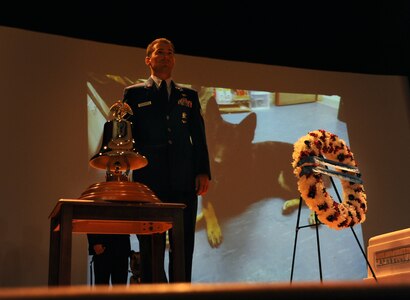 Staff Sgt. Brandon Edwards, 628th Security Forces dog handler, prepares to ring the bell in memory of Waldo, a military working dog, at Joint Base Charleston - Air Base, S.C.  June 6, 2012. Waldo was assigned to the 628th Security Forces Squadron and served most of his career here. He was deployed twice to Afghanistan. During his career, Waldo conducted 2,304 hours of searches and completed 425 hours of detection training. (U.S. Air Force photo/Airman 1st Class Ashlee Galloway)