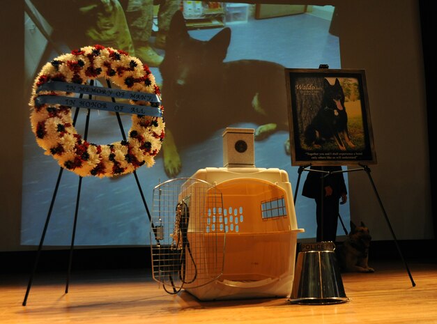 The empty kennel and overturned bucket serve as a memoir to Waldo, a military working dog, during his memorial service at Joint Base Charleston - Air Base, S.C.  June 6, 2012. Waldo was assigned to the 628th Security Forces Squadron and served most of his career here. He was deployed twice to Afghanistan. During his career, Waldo conducted 2,304 hours of searches and completed 425 hours of detection training. (U.S. Air Force photo/Airman 1st Class Ashlee Galloway)