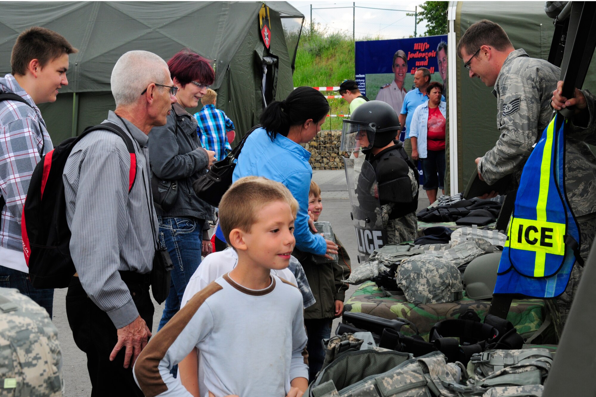 Members of the Rheinland-Pfalz community visit the 86th Security Forces Squadron
display at the Rheinland-Pfalz state fair, Ingelheim, Germany, June 1.
Different squadrons and groups from Team Ramstein had static displays at the
state fair to show the community what their mission is here. (U.S. Air Force photo/
Airman 1st Class Trevor Rhynes)