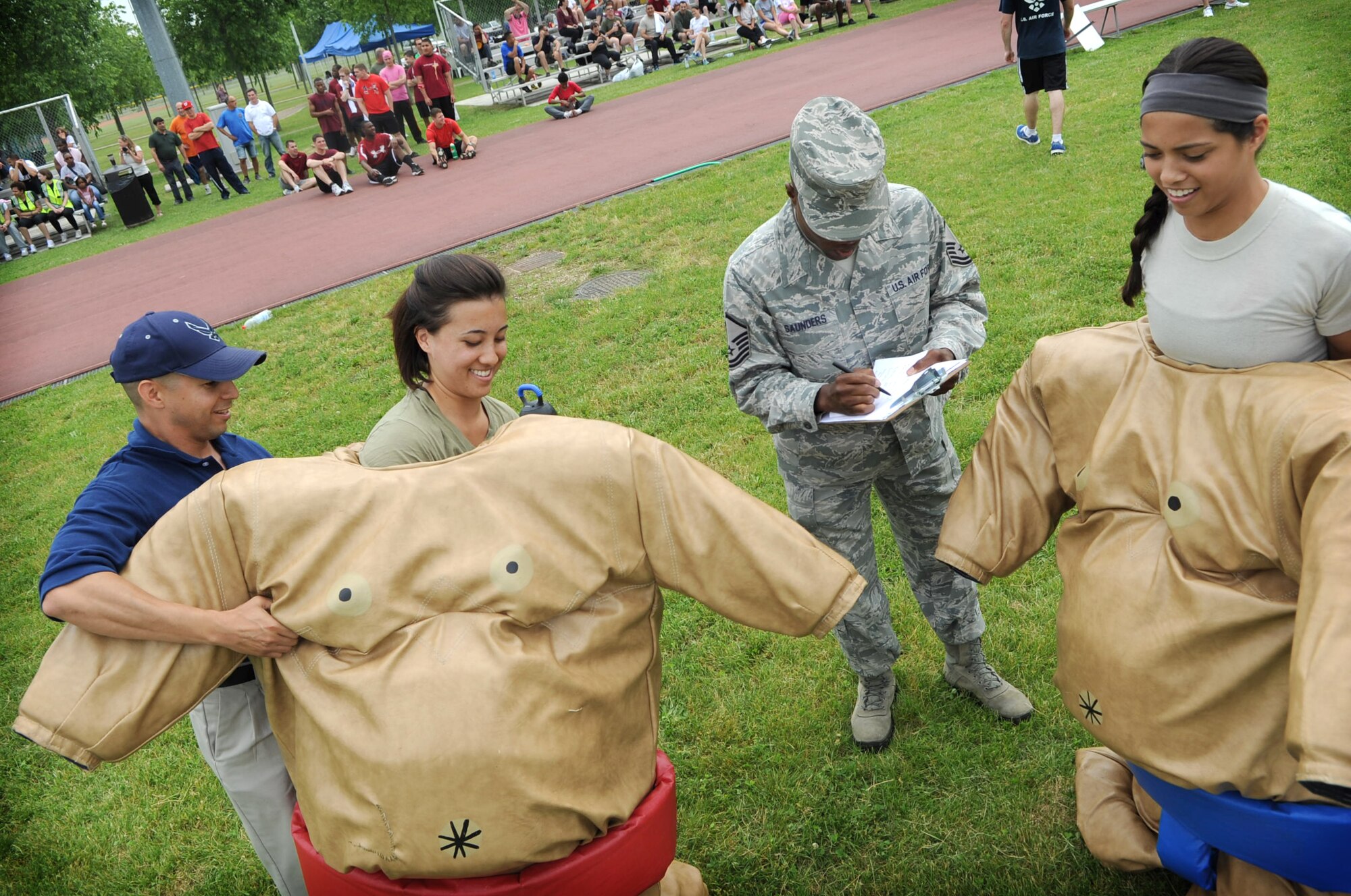Aviano team members prepare for a sumo wrestling match during the 31st Fighter Wing sports day tournament held at the Dragon Fitness Center June 1.  The event was hosted by the 31st Force Support Squadron and assisted by 66 base volunteers. (U.S. Air Force Photo by Staff Sgt. Evelyn Chavez)