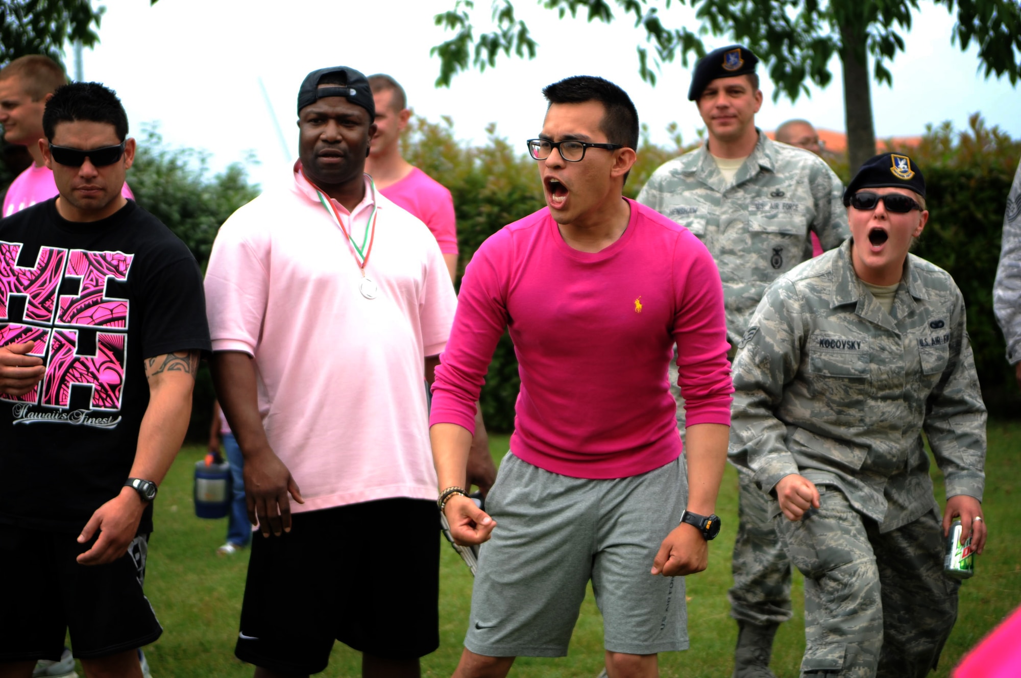 Defenders from the 31st Security Forces Squadron cheer on fellow team members during a 31st Fighter Wing sports day tournament held at the Dragon Fitness Center June 1.  Sports day was an all-day event put together to give the wing an opportunity to engage with each other through a variety of physical fitness activities.  (U.S. Air Force Photo by Staff Sgt. Evelyn Chavez)