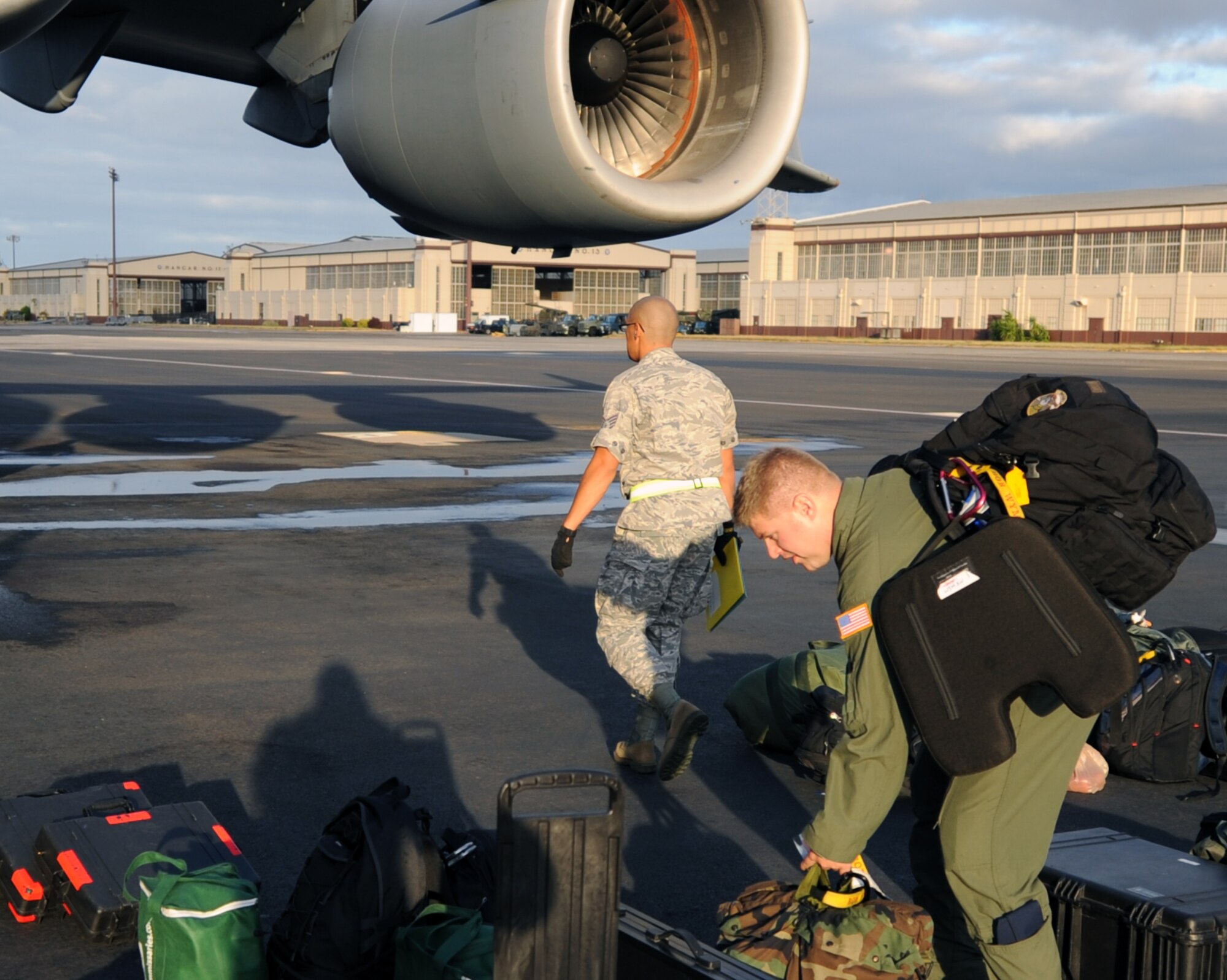 120606-F-MC921-006:  Tech. Sgt. Bob Wyman, an evaluator loadmaster from the 535th Airlift Squadron at Joint Base Pearl Harbor-Hickam, Hawaii, carries luggage to an awaiting C-17 Globemaster III in preparation for an early morning departure to Alaska June 6 for the RED FLAG-Alaska military exercise. RED FLAG-Alaska is one of the largest international air-combat employment exercises in the world and is designed to test the specific capabilities of the military units that take part in the exercise and increase their chance of survival during actual combat. (U.S. Air Force photo by Capt. Ben Sakrisson)