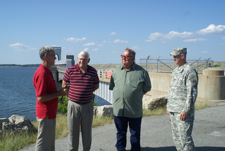 Pictured are Lifesaving Award recipient Dr. Robert Golly (left), Terry and Anthony Eddings, and U.S. Army Corps of Engineers Tulsa District Commander Col. Michael Teague at Lake Texoma, Texas, May 21, 2012, where Teague bestowed the award on Golly for saving the Eddings brothers from their sinking boat, April 24, 2012.

