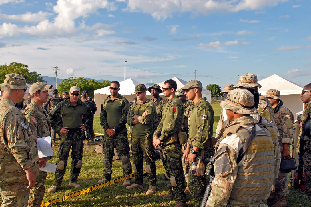 Members of special operations forces from several countries receive a safety briefing before the start of weapons familiarization for Fuerzas Comando 2012 at the Colombian National Training Center on Fort Tolemaida, Colombia, June 4, 2012.