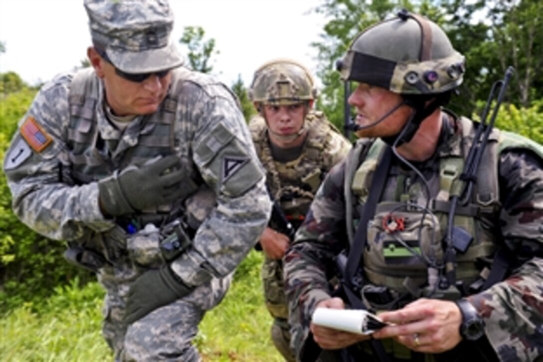 U.S. and Slovenian soldiers call in close air support during a deliberate attack exercise as part of the Immediate Response 2012 training exercise in Slunj, Croatia, May 31, 2012. The U.S. soldier, a joint terminal multinational center observer controller, is assigned to the Mississippi Air National Guard.