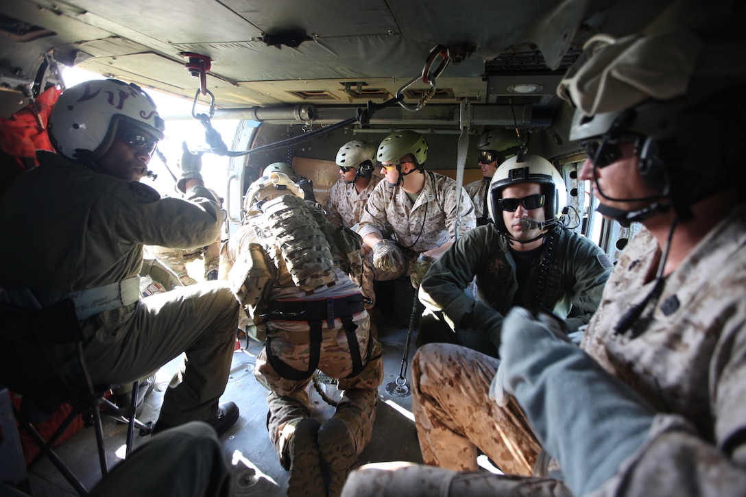 Marines with 3d Marine Special Operations Battalion, U.S. Marine Corps Forces, Special Operations Command, conduct predeployment training in Savannah, Ga., May 23. Marines prepare for helo casting inside a SH-60 Sea Hawk aircraft. 