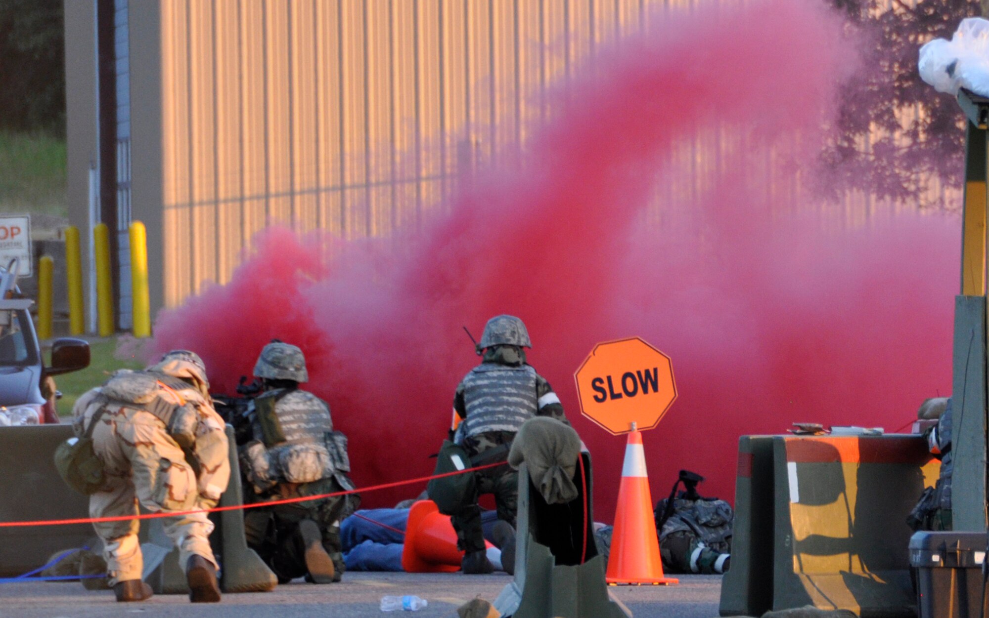VOLK FIELD, Wis. - Air Force Reserve security forces from the 302nd Airlift Wing, Peterson Air Force Base, Colo., react to a simulated bomb during an exercise June 5, here. Members of the 302nd and the 172nd Airlift Wing, Jackson, Miss. spent almost a week in central Wisconsin to prepare for the Operations Readiness Inspection that takes place October 2012. The scenario had the combined forces forward deployed to a foreign country, in support of U.S. operations. (U.S. Air Force photo/Maj. Corinna Moylan)