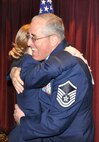 Master Sgt. Jim Clements, 446th Aerospace Medicine Squadron NCOIC of Optometry out of McChord Field, Wash. embraces his daughter, new second lieutenant, Monica Clements after she carried out her first duty of giving him his oath of office for his last reenlistment in the Air Force Reserve, June 2, 2012. Although Jim is approaching 32 years in the military, Monica graduated from the Air Force Academy, Colorado Springs, Colo., May 23, 2012. (U.S. Air Force photo/Tech. Sgt. Elizabeth Moody) 