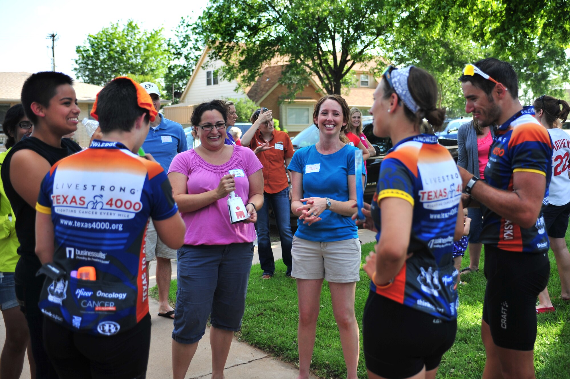 Amy Hinkle and Cheryl Jimenez, military spouses and Texas 4000 sponsors, welcome cyclists of this year?s LIVESTRONG team at a local reception in Clovis, N.M., June 7, 2012. Cannon Air Force Base, N.M., affiliates provided food and shelter for the team on their journey to Anchorage, Alaska. (U.S. Air Force photo by Airman 1st Class Alexxis Pons Abascal)  