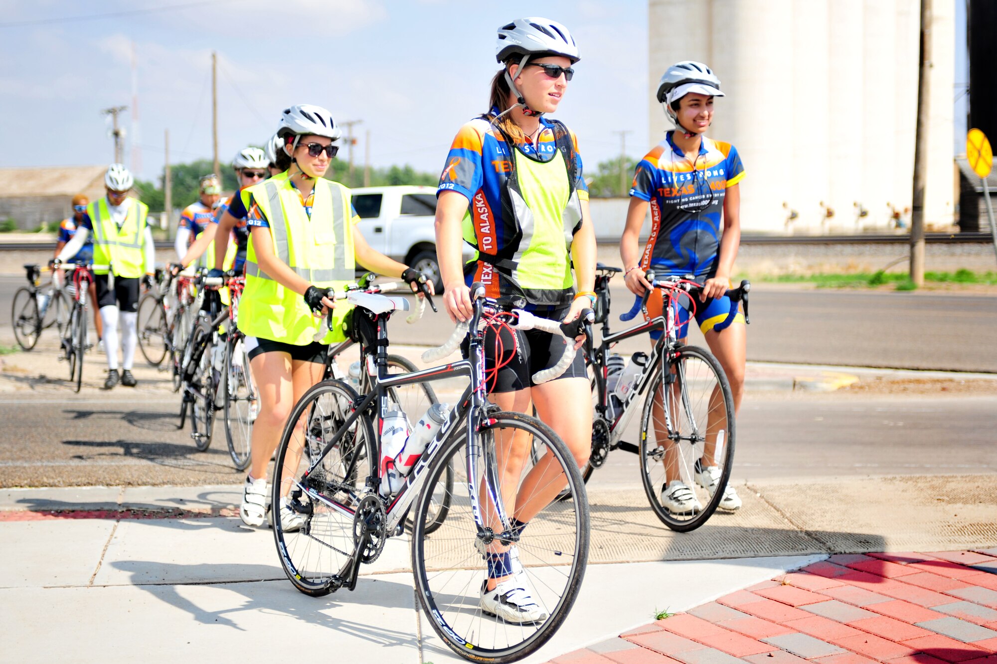 A group of Texas 4000 cyclists cross the New Mexico border just east of Clovis, N.M., after biking from Farwell, Texas, June 7, 2012. The Texas 4000 is sponsored by partners at Monroe Dunaway Anderson Cancer Center and LIVESTRONG and gains local support from military families at Cannon Air Force Base, N.M. (U.S. Air Force photo by Airman 1st Class Alexxis Pons Abascal)  