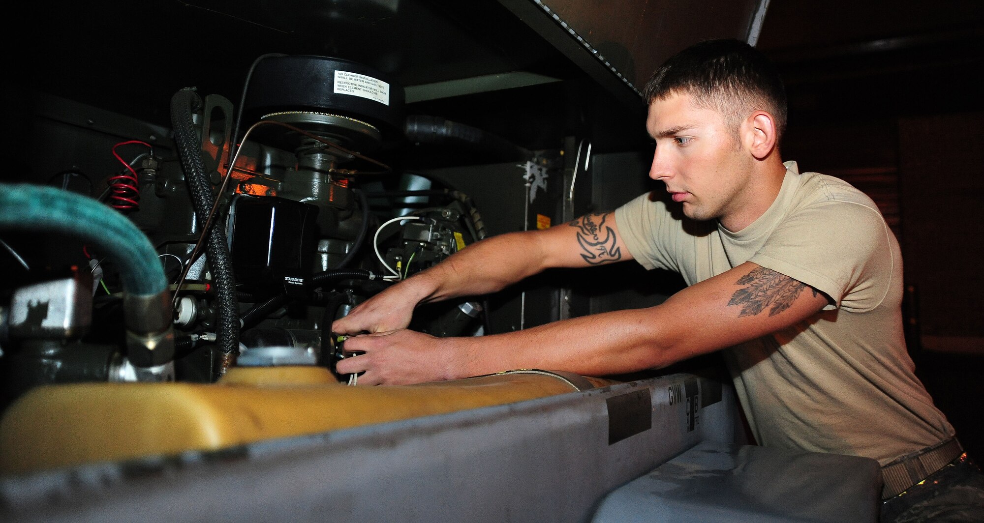 WHITEMAN AIR FORCE BASE, Mo. -- Senior Airman John McLaughlin, 509th MXS Aerospace Ground Equipment journeyman, checks belt tension on an MC-6 diesel engine during a service inspection May 31, 2012. The engine is used by Airmen who work in the low observable career field to dry or ‘cure’ paint on the B-2 Spirit. (U.S. Air Force photo/Senior Airman Nick Wilson) (Released) 