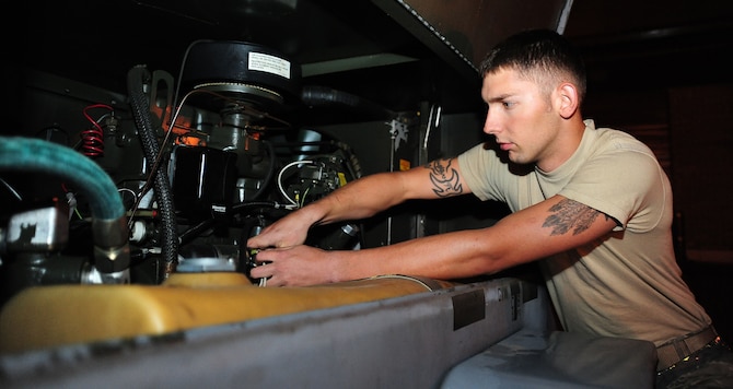 WHITEMAN AIR FORCE BASE, Mo. -- Senior Airman John McLaughlin, 509th MXS Aerospace Ground Equipment journeyman, checks belt tension on an MC-6 diesel engine during a service inspection May 31, 2012. The engine is used by Airmen who work in the low observable career field to dry or ‘cure’ paint on the B-2 Spirit. (U.S. Air Force photo/Senior Airman Nick Wilson) (Released) 