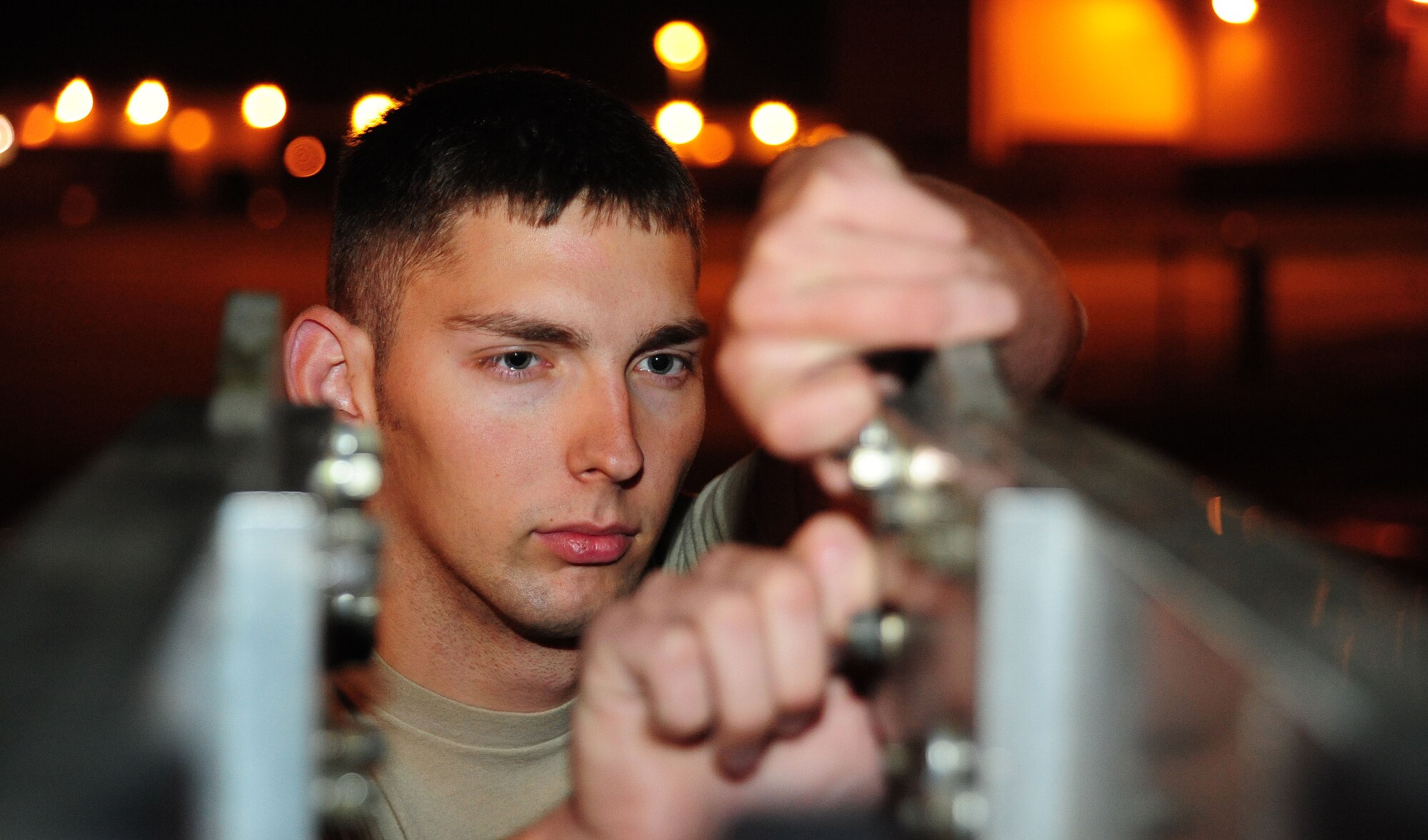 WHITEMAN AIR FORCE BASE, Mo. -- Senior Airman John McLaughlin, 509th MXS Aerospace Ground Equipment journeyman, replaces pins on an MD-1 towbar during a service inspection May 31, 2012. Service inspections ensure equipment needed for maintenance operations on a plane are in working order. (U.S. Air Force photo/Senior Airman Nick Wilson) (Released)
