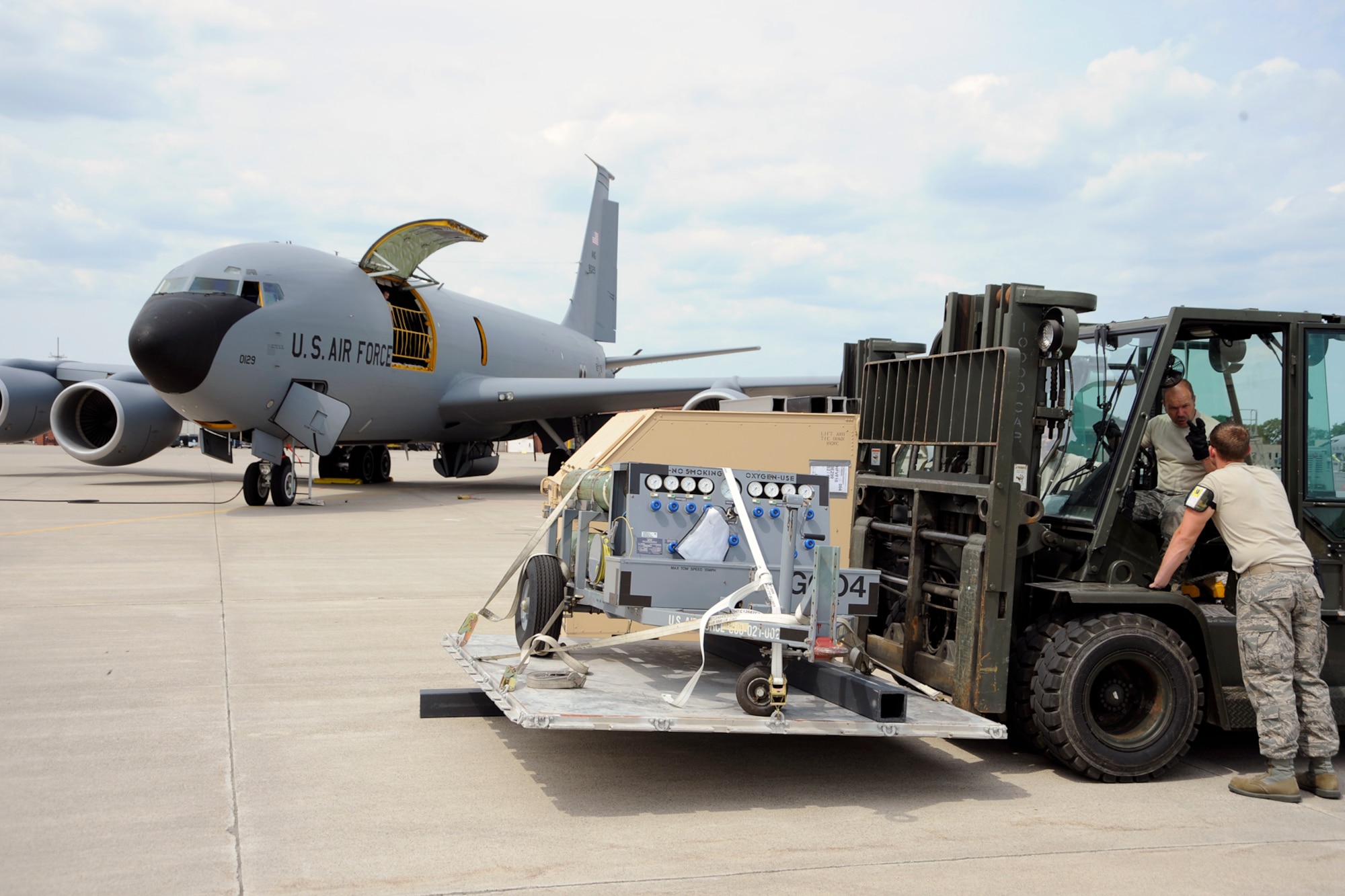 Airmen from the 127th Wing reload cargo placed in individual shipping units (ISUs) from a C-130 to a KC-135 to ship to Estonia on June 8, 2012, at Selfridge Air National Guard Base, Mich. The cargo equipment is headed to Saber Strike 12, a US Army European command-led theater security cooperation exercise conducted in the Baltic States (Estonia, Latvia and Lithuania). The plane swap led to repacking the cargo into ISUs of a smaller size. (USAF photo by John S. Swanson) 


