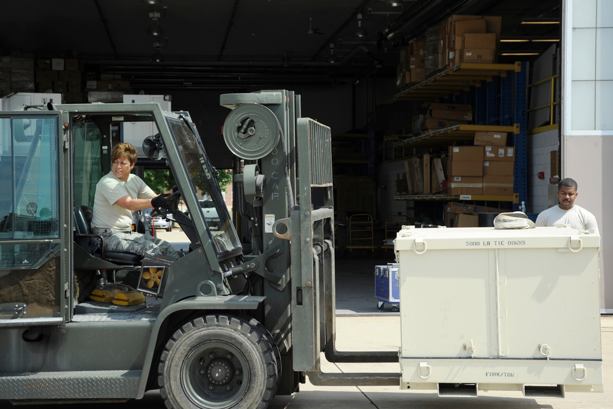 Airmen from the 127th Wing reload cargo placed in individuals shipping units (ISUs) from a C-130 to a KC-135 to ship to Estonia on June 8, 2012, at Selfridge Air National Guard Base, Mich.  The cargo equipment is headed to Saber Strike 12, a US Army European command-led theater security cooperation exercise conducted in the Baltic States (Estonia, Latvia and Lithuania). The plane swap led to repacking the cargo into ISUs of a smaller size. (USAF photo by John S. Swanson)