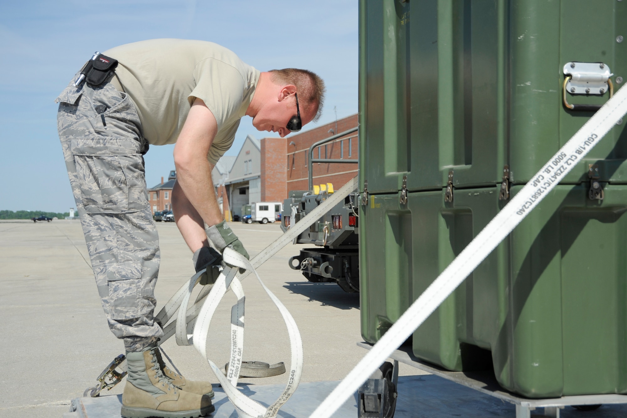 Airmen from the 127th Wing reload cargo placed in individuals shipping units (ISUs) from a C-130 to a KC-135 to ship to Estonia on June 8, 2012, at Selfridge Air National Guard Base, Mich.  The cargo equipment is headed to Saber Strike 12, a US Army European command-led theater security cooperation exercise conducted in the Baltic States (Estonia, Latvia and Lithuania). The plane swap led to repacking the cargo into ISUs of a smaller size. (USAF photo by John S. Swanson)