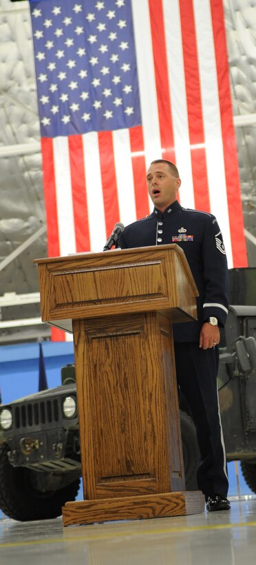A member of the Air Force Singing Sergeants sings the National Anthem at Chief Master Sgt. Anthony Brinkley's retirement ceremony June 8, 2012.  Chief Brinkley served more than 28 years in the Air Force and was Command Chief for the 11th Wing and Joint Base Andrews.  (U.S. Air Force Photo by Staff Sgt. Torey Griffith)