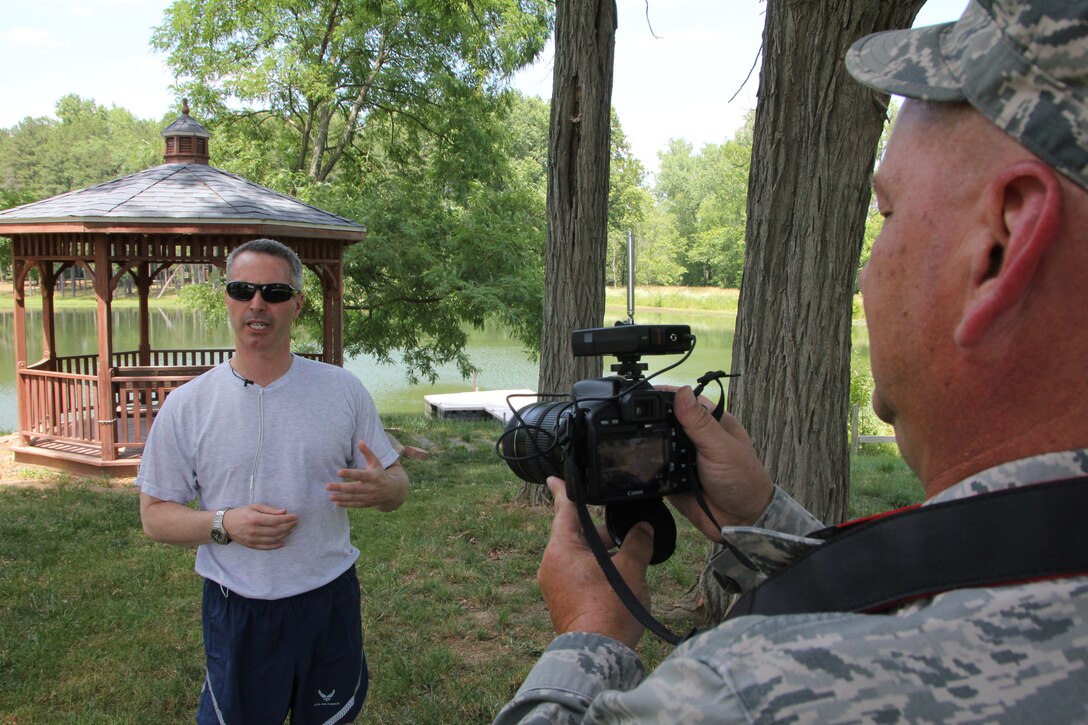 Col. Mark Casto, vice commander of the 932nd Airlift Wing, is tasked with working fitness improvement awareness at the Illinois Air Force Reserve unit. He shares his thoughts on stretching and demonstrates how to avoid obstacles and stay safe along the way by working on the "core" of the body.  Capturing his ideas and suggestions to video is Tech. Sgt. Gerald Sonnenberg.  The colonel enjoys working out in a variety of locations.  (U.S. Air Force photo/Maj. Stan Paregien)


