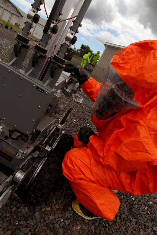 Tech. Sgt. David Niedzwiadek, Explosive Ordnance Disposal (EOD) technician checks an ANDROS F6A Explosive Ordnance Disposal robot during an exercise at the 177th Fighter Wing June 6, 2012. Airmen from the 177th along with New Jersey National Guard Soldiers and Airmen of the 21st Civil Support Team (Weapons of Mass Destruction), South Jersey Transit Authority firefighters and New Jersey State Police responded to a simulated weapons of mass destruction incident.  Members of the 177th Explosive Ordnance Disposal team worked with the 21st CST in reacting to a simulated explosion on base. The 21st CST supports civil authorities by responding to a weapons of mass destruction (WMD) situation. The unit is made up of full-time New Jersey Army and Air National Guard members that have been trained and equipped to provide support to civil authorities at a domestic chemical, biological, radiological, nuclear and high-explosive (CBRNE) incident site by identifying CBRNE agents/substances, assessing current and projected consequences and advising on response measures and assisting with appropriate requests for state support.  U.S. Air Force photo by Master Sgt. Mark C. Olsen