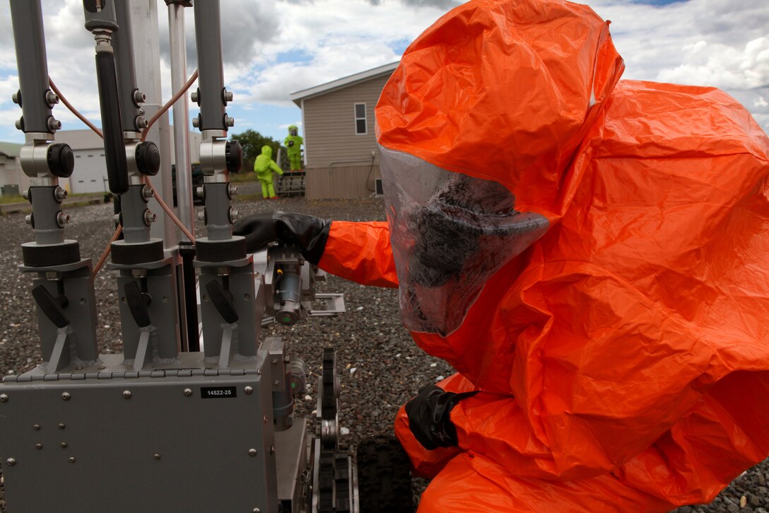 Tech. Sgt. David Niedzwiadek, Explosive Ordnance Disposal (EOD) technician checks an ANDROS F6A Explosive Ordnance Disposal robot during an exercise at the 177th Fighter Wing June 6, 2012. Airmen from the 177th along with New Jersey National Guard Soldiers and Airmen of the 21st Civil Support Team (Weapons of Mass Destruction), South Jersey Transit Authority firefighters and New Jersey State Police responded to a simulated weapons of mass destruction incident.  Members of the 177th Explosive Ordnance Disposal team worked with the 21st CST in reacting to a simulated explosion on base. The 21st CST supports civil authorities by responding to a weapons of mass destruction (WMD) situation. The unit is made up of full-time New Jersey Army and Air National Guard members that have been trained and equipped to provide support to civil authorities at a domestic chemical, biological, radiological, nuclear and high-explosive (CBRNE) incident site by identifying CBRNE agents/substances, assessing current and projected consequences and advising on response measures and assisting with appropriate requests for state support.  U.S. Air Force photo by Master Sgt. Mark C. Olsen