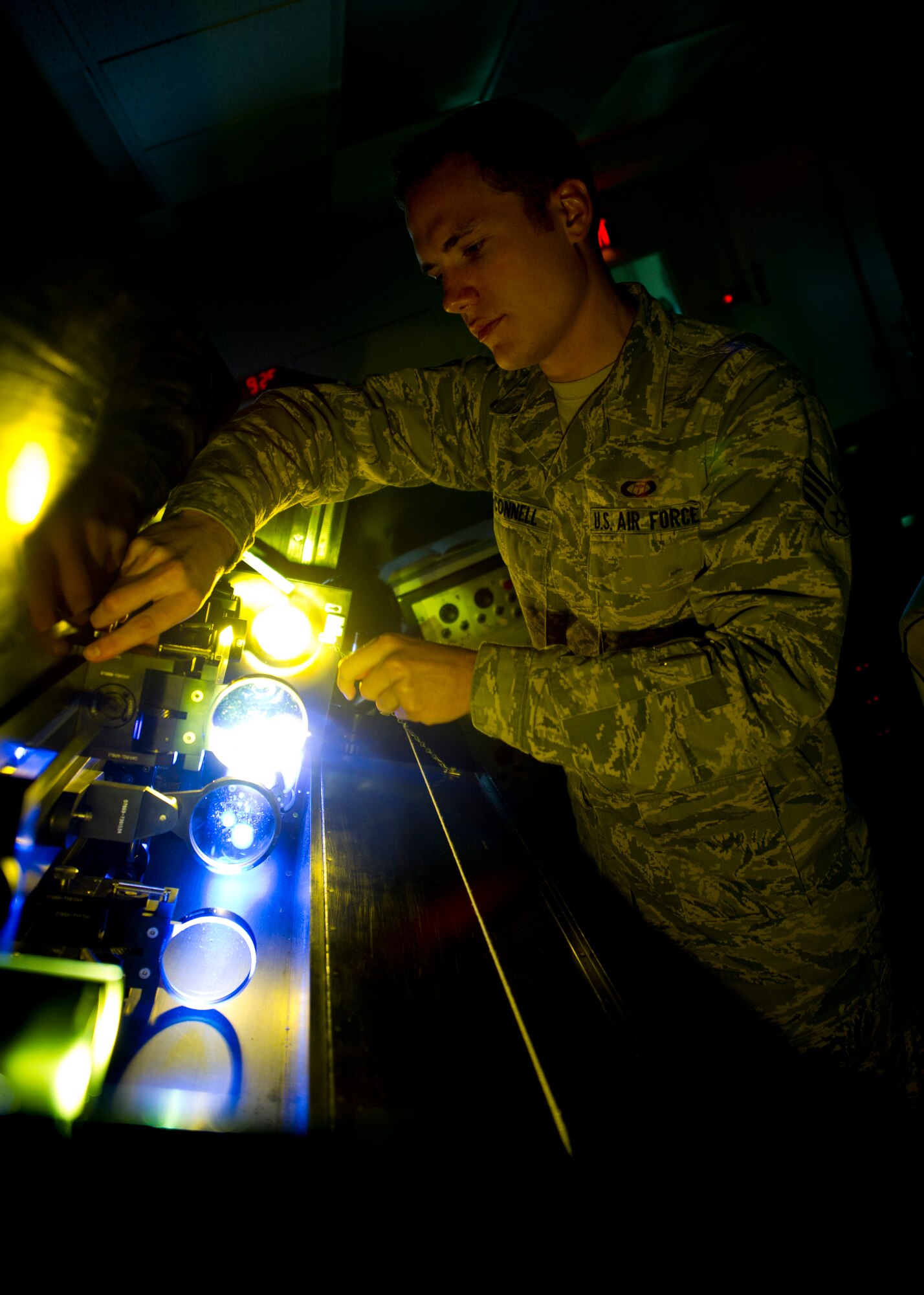 Senior Airman Erin O’Connell, Detachment 4, 2nd Weather Squadron solar analyst, calibrates a solar telescope at the Holloman Air Force Base, N.M., solar observatory June 7. Solar activity is constantly analyzed and monitored by analysts to prevent solar flares from negatively affecting space operations. This highly sophisticated telescope uses a hydrogen filter that allows solar analysts to clearly observe the activity on the surface of the sun. (U.S. Air Force photo by Airman 1st Class Daniel E. Liddicoet/Released)