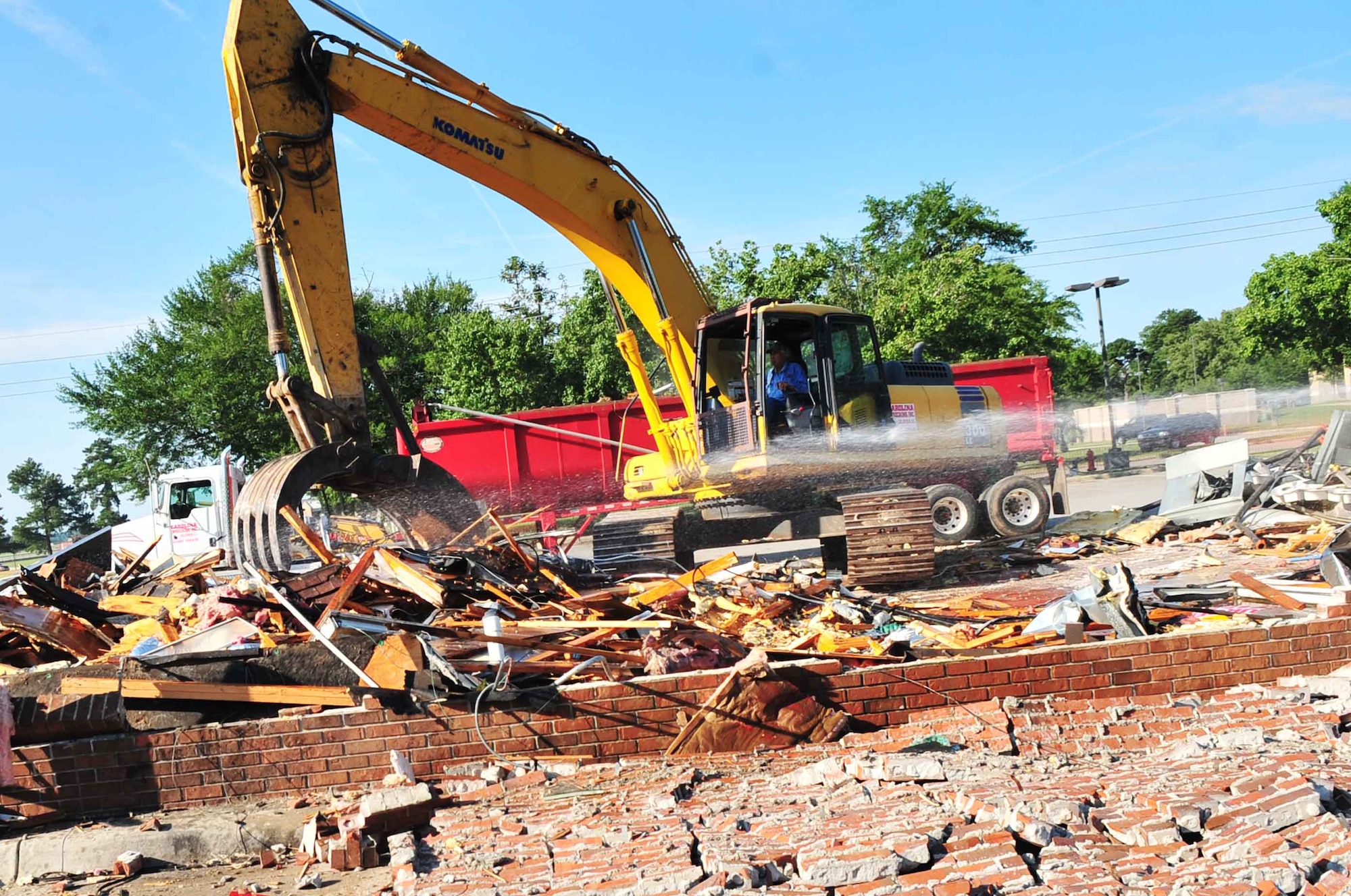 An abandoned Burger King is torn down to prepare for green space, Shaw Air Force Base, S.C., June 8, 2012. The new Burger King relocated to the food court inside the new Exchange. (U.S. Air Force photo by Airman 1st Class Ashley L. Gardner/ Released)