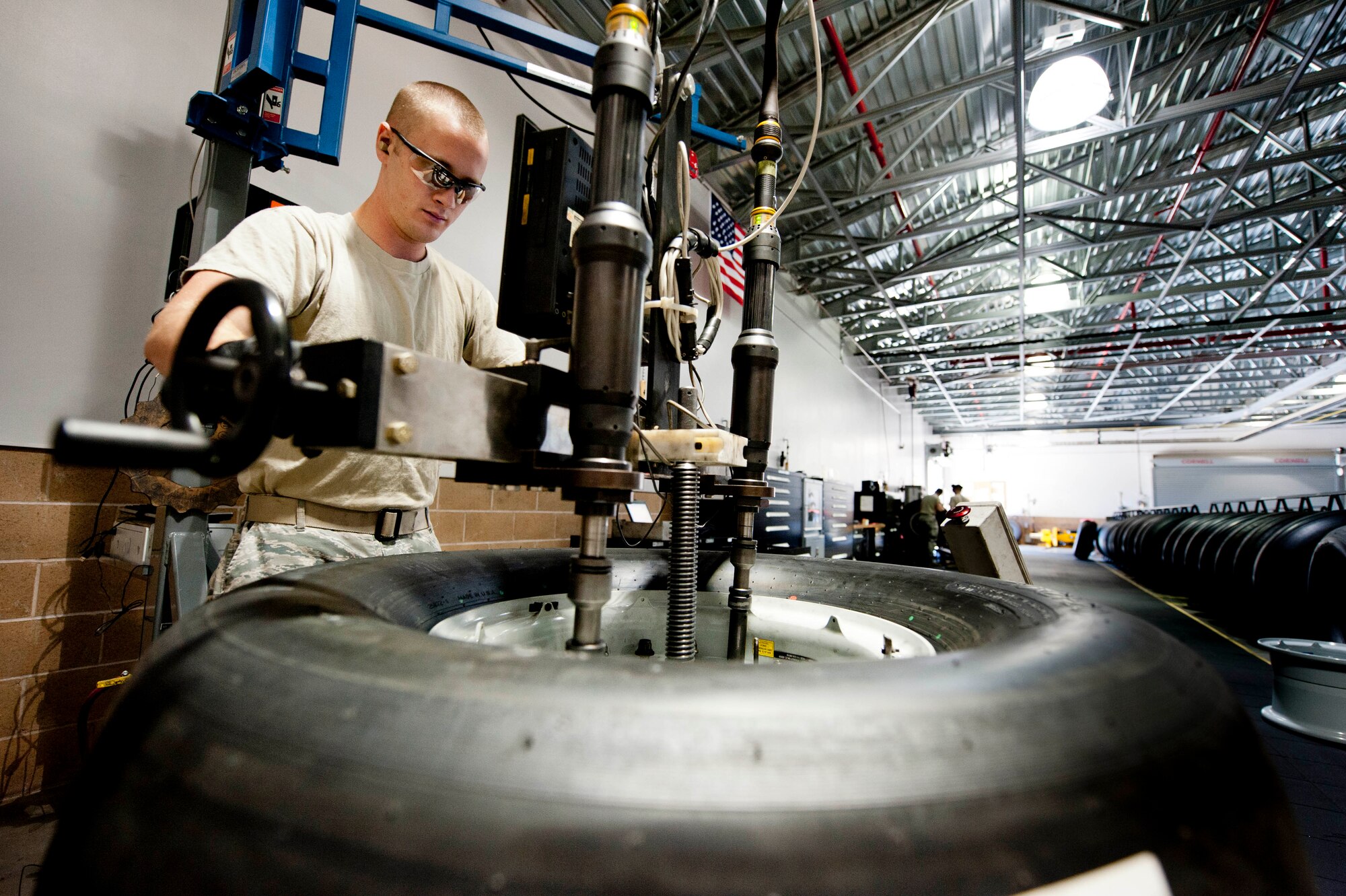 Senior Airman Erin Lukemire, 60th Maintenance Squadron crew chief, uses a torque machine to apply torque to the bolts of a C-17 Globemaster III wheel. Lukemire must apply 170 psi of torque to the wheel for it to function properly. (U.S. Air Force photo/Airman 1st Class Nicole Leidholm)