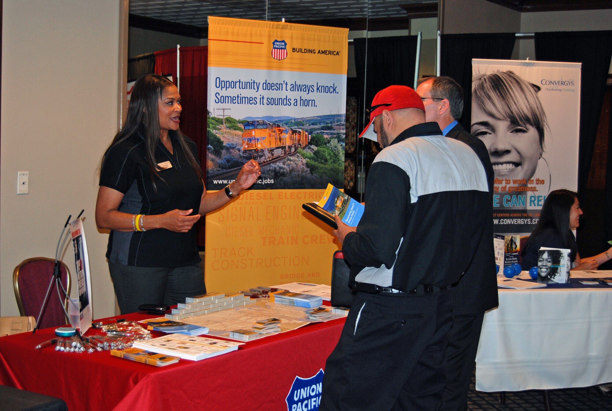 An employer from the Union Pacific Railroad discusses employment possibilities during the Hiring our Heroes job fair May 30. The job fair is sponsored by the U.S. Chamber of Commerce. In 2011, 100 job fairs were hosted and more than 9,000 veterans and spouses were employed through the program. (U.S. Air Force photo/Lea Johnson)