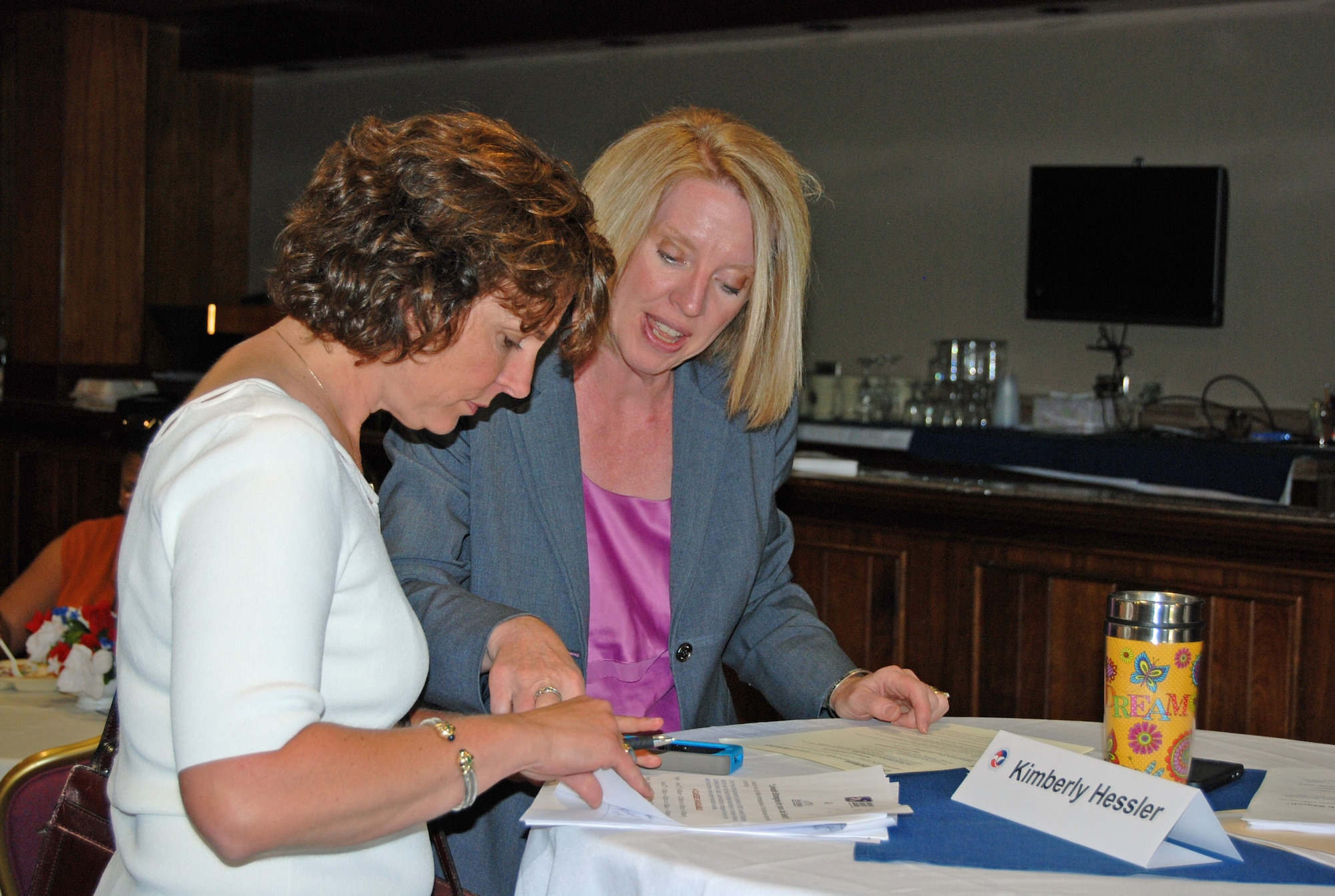 Kimberly Hessler, Homeland Security Careers, mentors a spouse in networking and how to market herself to employers. The mentoring event was part of the Hiring our Heroes job fair sponsored by the U.S. Chamber of Commerce May 30. (U.S. Air Force photo/Lea Johnson)