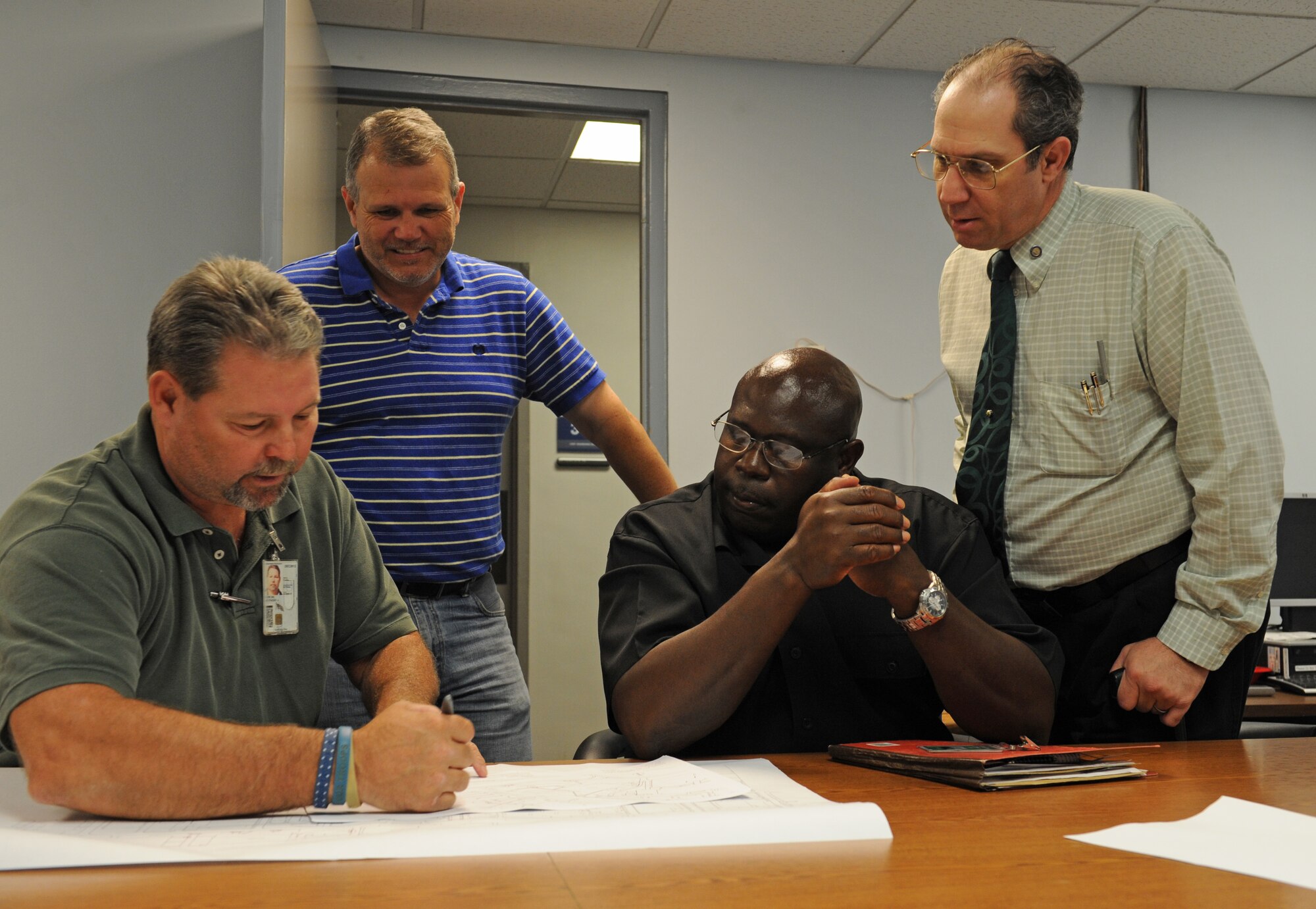 Members of the 2nd Civil Engineer Squadron Programming Flight meet with 2nd Bomb Wing Anti-Terrorism Force Protection personnel to discuss security concerns in base infrastructure on Barksdale Air Force Base, La., June 7. By discussing these security concerns, base infrastructures that do not meet Air Force standards can be addressed and fixed in the near future. (U.S. Air Force photo/Airman 1st Class Benjamin Gonsier)(RELEASED)