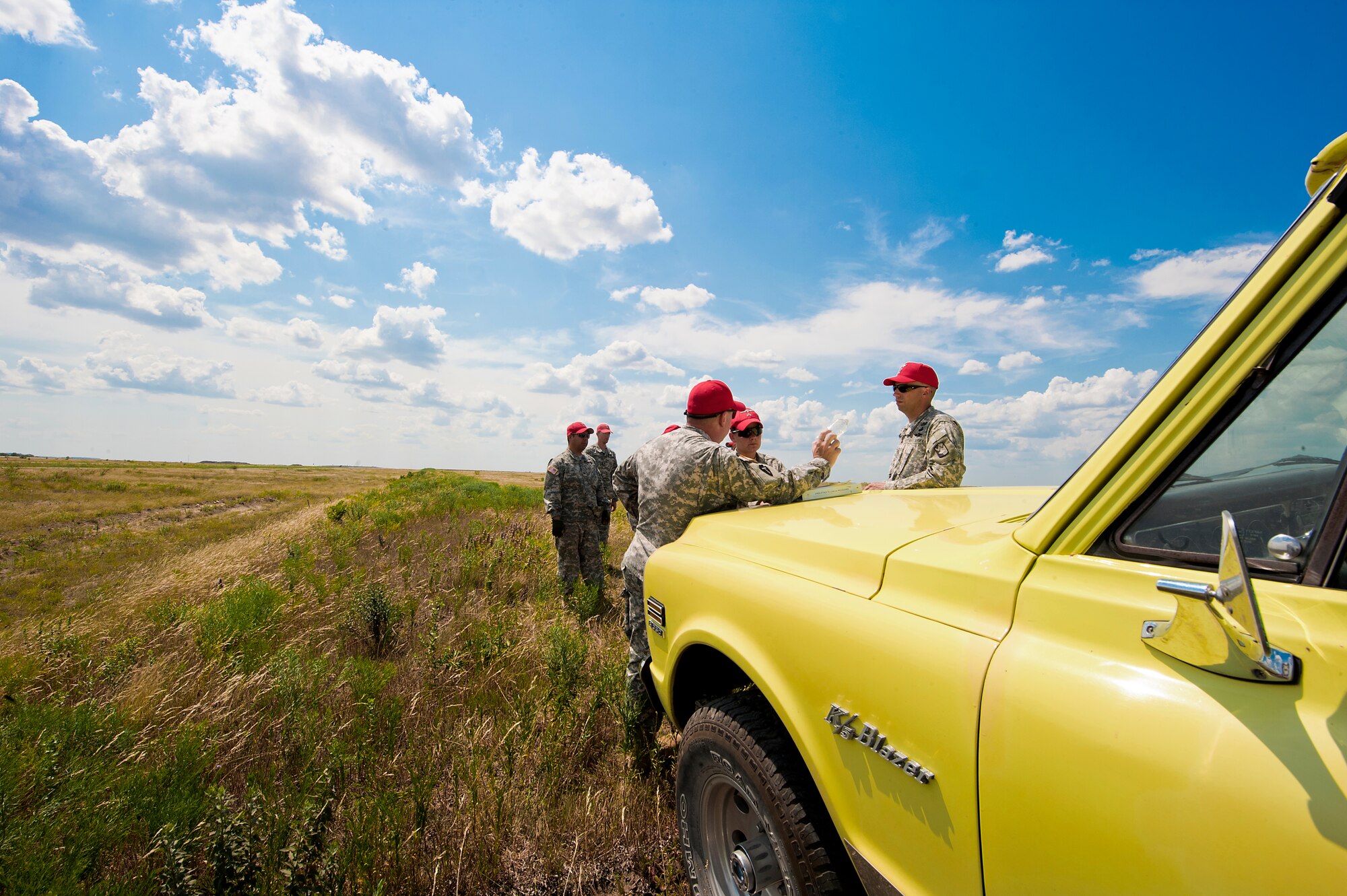 Members of the 294th Quartermaster Company gather in front of a Fort Hood drop zone prior to a Joint Precision Airdrop System exercise June 6, 2012, at Fort Hood, Texas. JPADS is an airdrop system that uses Global Positioning Satellite, steerable parachutes and an onboard computer to steer loads to a designated point of impact on a drop zone - similar to joint direct attack munitions.  (U.S. Air Force photo by Airman 1st Class Damon Kasberg /Released)