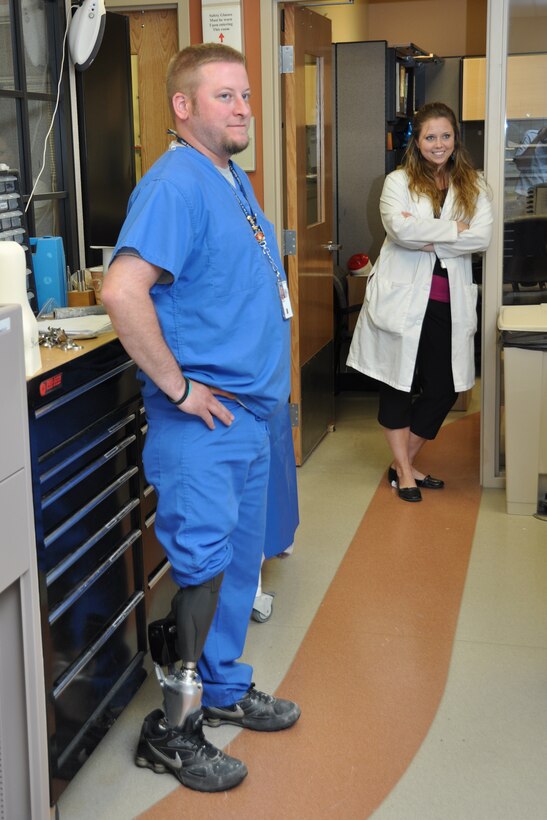 LOUIS STOKES CLEVELAND VA MEDICAL CENTER, Ohio – Matthew Fleming, student at the Medical Center and Marine veteran, shows off his prosthetic leg to Youngstown Air Reserve Station Reservists during the Louis Stokes Cleveland VA Medical Center June 4, 2012. Fleming is using the Biom Power Foot from the company iWalk, which is the most advanced of its kind and is part of the on-going process to develop better prosthetic technology for amputees. The Cleveland VA is a multi-specialty outpatient clinic and vet center that includes specialized programs such as blind rehabilitation, polytrauma care, invasive cardiology, post-traumatic stress disorders, comprehensive cancer center and several other areas of expertise.  (U.S. Air Force photo by Staff Sgt. Megan Tomkins)
